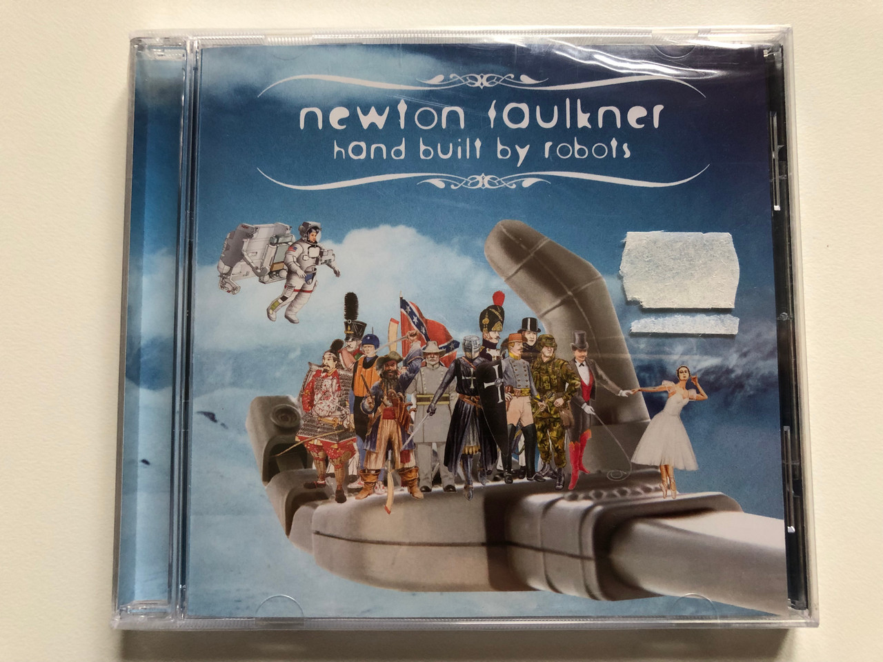 https://cdn10.bigcommerce.com/s-62bdpkt7pb/products/0/images/201910/Newton_Faulkner_Hand_Built_By_Robots_Brightside_Recordings_Audio_CD_2007_88697113062_1__08462.1639671748.1280.1280.JPG?c=2&_gl=1*nu68fd*_ga*MjA2NTIxMjE2MC4xNTkwNTEyNTMy*_ga_WS2VZYPC6G*MTYzOTY2NTgzMC4yMjAuMS4xNjM5NjcxNTI5LjYw
