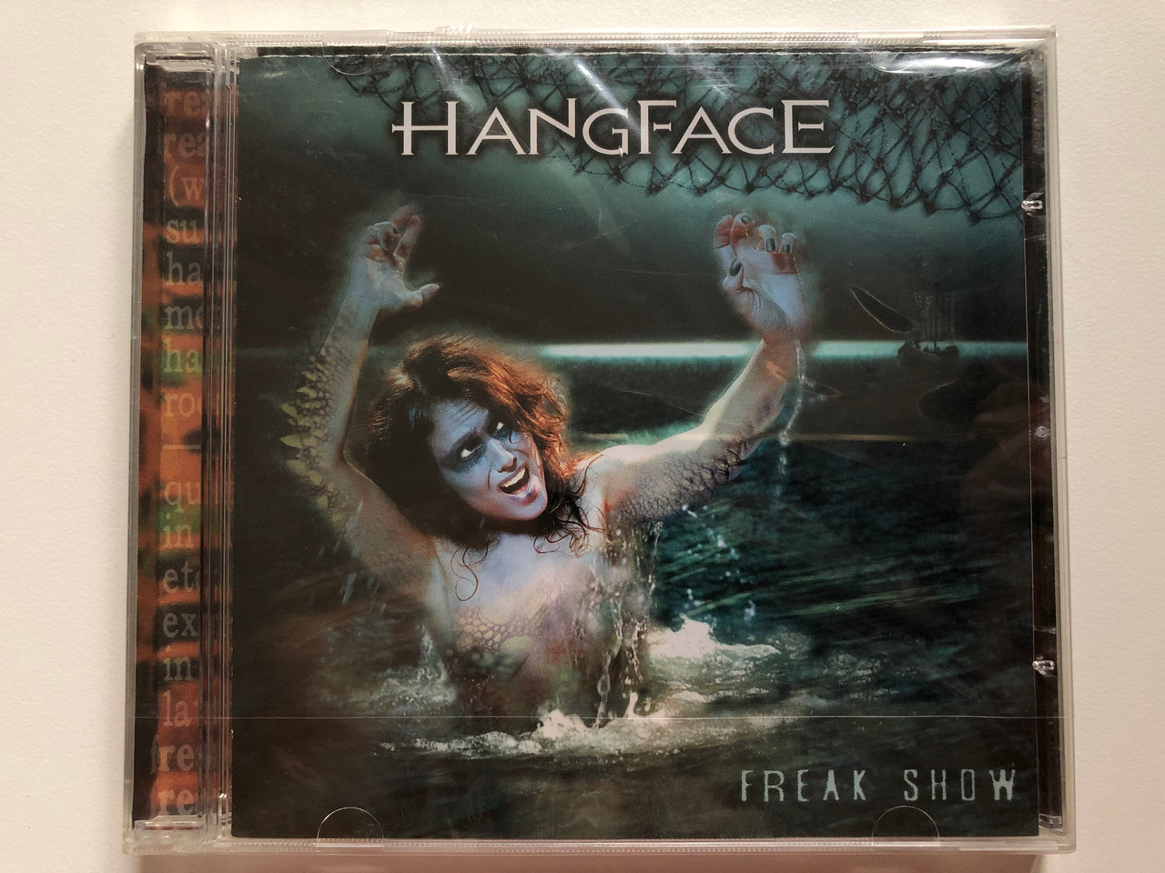 https://cdn10.bigcommerce.com/s-62bdpkt7pb/products/0/images/201954/Hangface_Freak_Show_K-Entertainment_Audio_CD_2005_K-ENT_42643223-01_1__13246.1639750937.1280.1280.JPG?c=2&_gl=1*rsydch*_ga*MjA2NTIxMjE2MC4xNTkwNTEyNTMy*_ga_WS2VZYPC6G*MTYzOTc0OTMxNS4yMjEuMS4xNjM5NzUwODM1LjE0