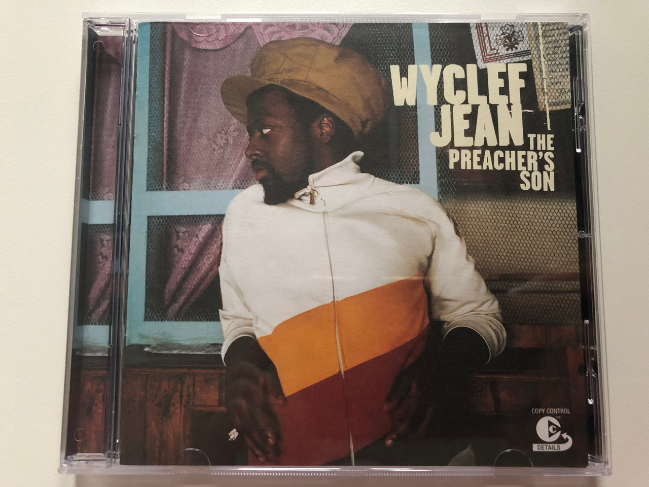 https://cdn10.bigcommerce.com/s-62bdpkt7pb/products/0/images/202389/Wyclef_Jean_The_Preachers_Son_J_Records_Audio_CD_2003_82876_56543_2_1__59426.1640077368.1280.1280.JPG?c=2&_gl=1*1fxwz0c*_ga*MjA2NTIxMjE2MC4xNTkwNTEyNTMy*_ga_WS2VZYPC6G*MTY0MDA2ODkyOS4yMjUuMS4xNjQwMDc3MDkzLjI5