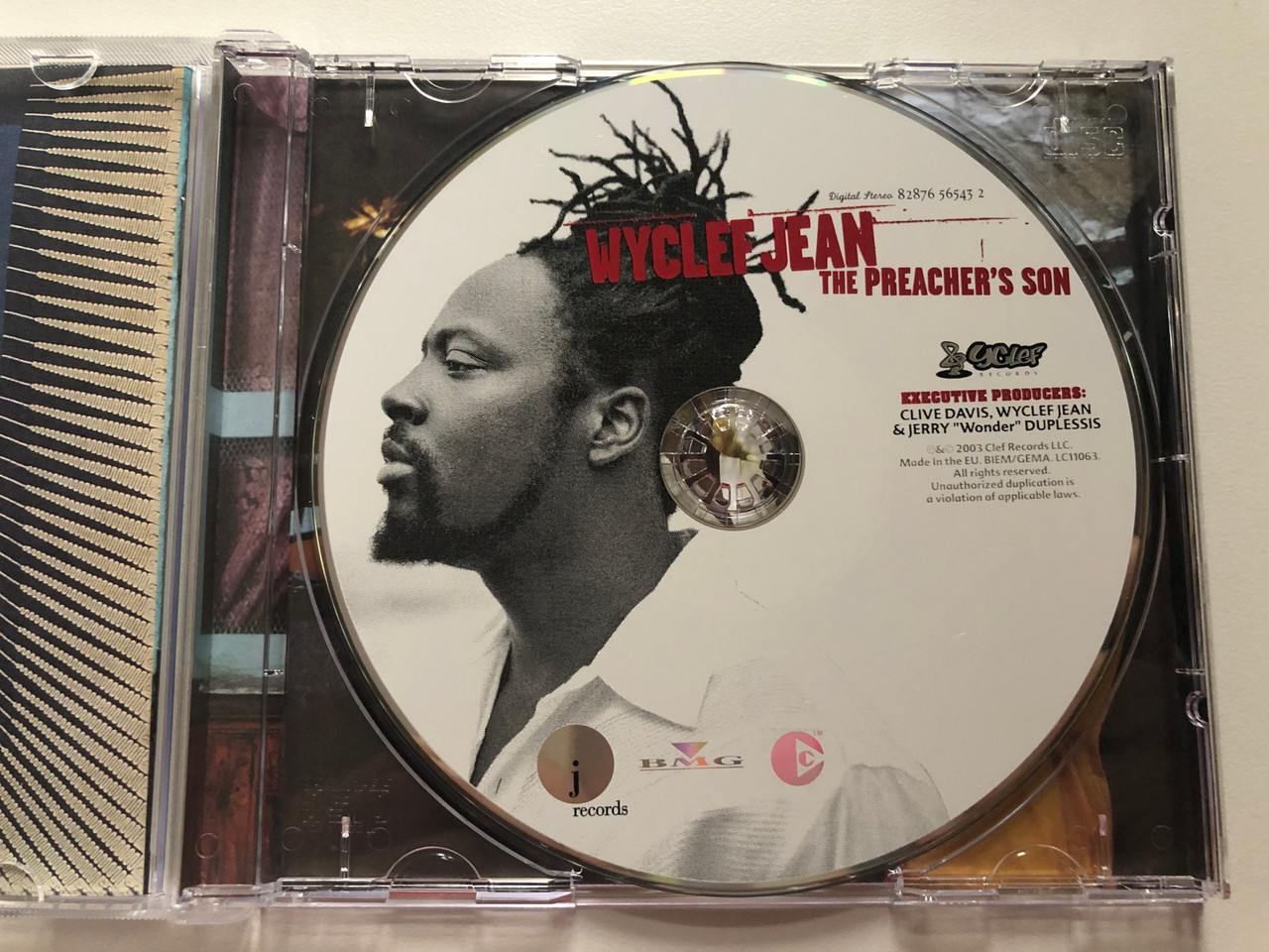 https://cdn10.bigcommerce.com/s-62bdpkt7pb/products/0/images/202390/Wyclef_Jean_The_Preachers_Son_J_Records_Audio_CD_2003_82876_56543_2_3__94708.1640077371.1280.1280.JPG?c=2&_gl=1*1fxwz0c*_ga*MjA2NTIxMjE2MC4xNTkwNTEyNTMy*_ga_WS2VZYPC6G*MTY0MDA2ODkyOS4yMjUuMS4xNjQwMDc3MDkzLjI5