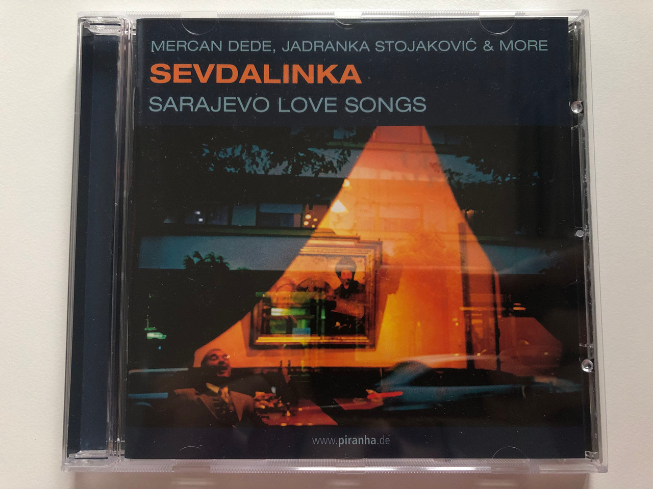 https://cdn10.bigcommerce.com/s-62bdpkt7pb/products/0/images/202400/Mercan_Dede_Jadranka_Stojakovi_More_Sevdalinka_Sarajevo_Love_Songs_Piranha_Audio_CD_2007_PIR2113_1__40278.1640078467.1280.1280.JPG?c=2&_gl=1*zomuyv*_ga*MjA2NTIxMjE2MC4xNTkwNTEyNTMy*_ga_WS2VZYPC6G*MTY0MDA2ODkyOS4yMjUuMS4xNjQwMDc4MjQwLjMx