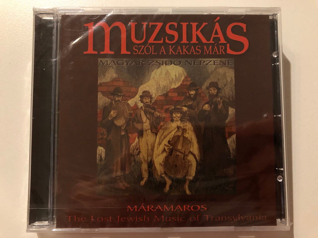 https://cdn10.bigcommerce.com/s-62bdpkt7pb/products/0/images/202577/Muzsiks_Szl_A_Kakas_Mr_-_The_Lost_Jewish_Music_of_Transylvania_Out_Of_Hungary_released_as_Maramaros_Muzsiks_Audio_CD_2000_MU-002_1__08949.1640160463.1280.1280.JPG?c=2&_gl=1*v86qa*_ga*MjA2NTIxMjE2MC4xNTkwNTEyNTMy*_ga_WS2VZYPC6G*MTY0MDE1NDY1OS4yMjYuMS4xNjQwMTYwMTYzLjI.
