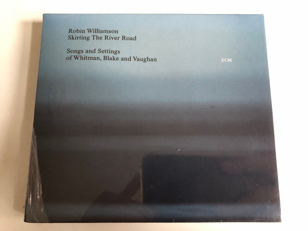 https://cdn10.bigcommerce.com/s-62bdpkt7pb/products/0/images/202855/Robin_Williamson_Skirting_The_River_Road_Songs_and_Settings_of_Whitman_Blake_and_Vaughan_ECM_Records_Audio_CD_2002_ECM_1785_1__61320.1640265323.1280.1280.JPG?c=2&_gl=1*k6gqkj*_ga*MjA2NTIxMjE2MC4xNTkwNTEyNTMy*_ga_WS2VZYPC6G*MTY0MDI1OTg0MS4yMzAuMS4xNjQwMjY1MzEyLjYw