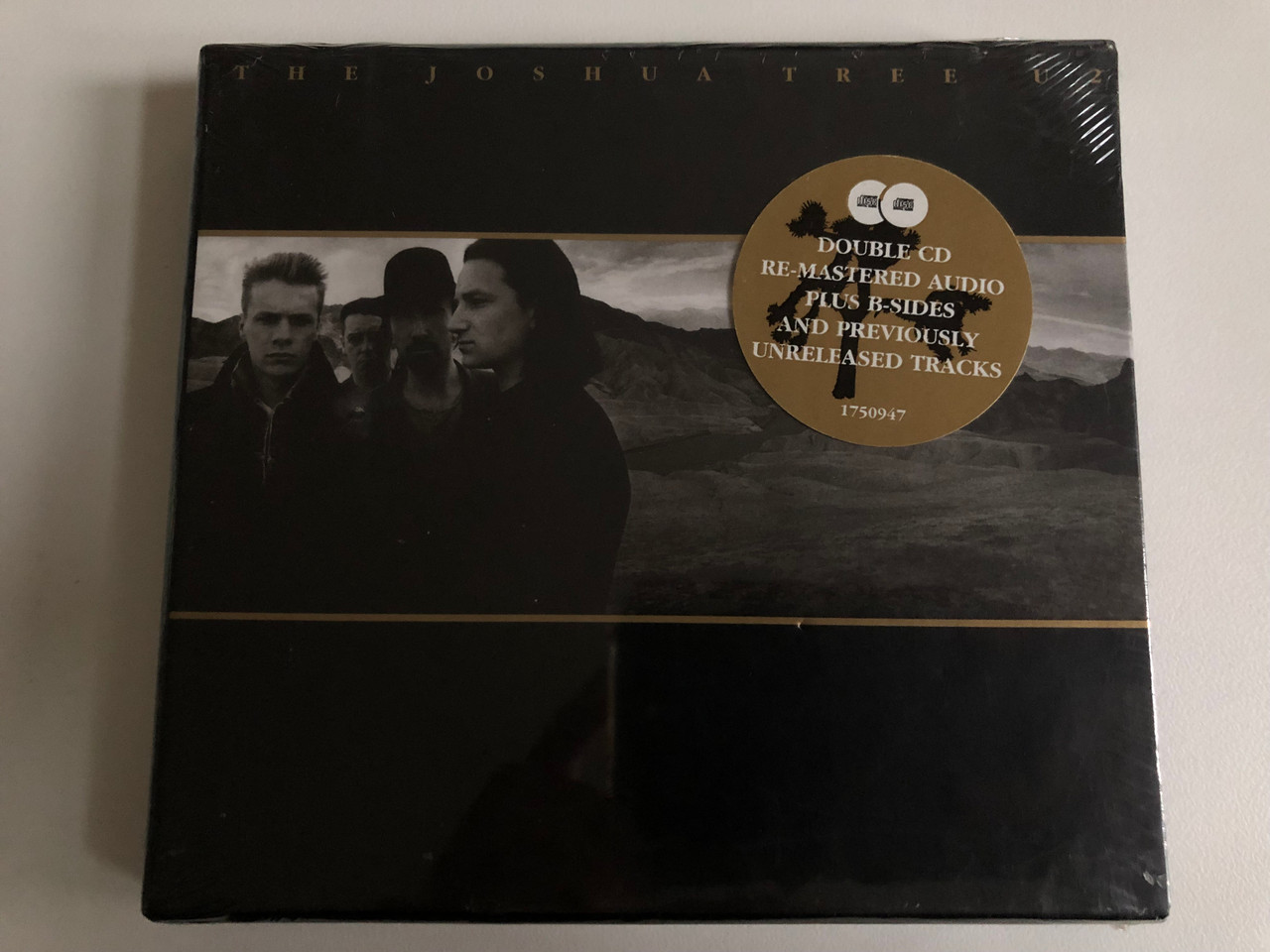 https://cdn10.bigcommerce.com/s-62bdpkt7pb/products/0/images/202860/U2_The_Joshua_Tree_Double_CD_Re-Mastered_Audio_Plus_B-Sides_And_Previously_Unreleased_Tracks_Island_Records_2x_Audio_CD_2007_1750947_1__81063.1640265868.1280.1280.JPG?c=2&_gl=1*16m9bm3*_ga*MjA2NTIxMjE2MC4xNTkwNTEyNTMy*_ga_WS2VZYPC6G*MTY0MDI1OTg0MS4yMzAuMS4xNjQwMjY1NzE1LjUw
