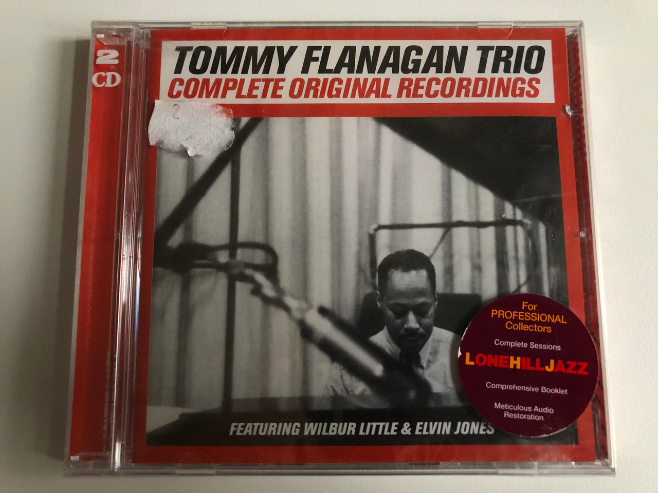 https://cdn10.bigcommerce.com/s-62bdpkt7pb/products/0/images/202938/Tommy_Flanagan_Trio_Complete_Original_Recordings_-_Featuring_Wilbur_Little_Elvin_Jones_For_Professional_Collectors_Complete_Sessions._Comprehesive_Booklet_Meticulous_Audio_Restoration_1__47997.1640340209.1280.1280.JPG?c=2&_gl=1*h1b03h*_ga*MjA2NTIxMjE2MC4xNTkwNTEyNTMy*_ga_WS2VZYPC6G*MTY0MDMzOTQyOC4yMzIuMS4xNjQwMzM5OTc3LjE1