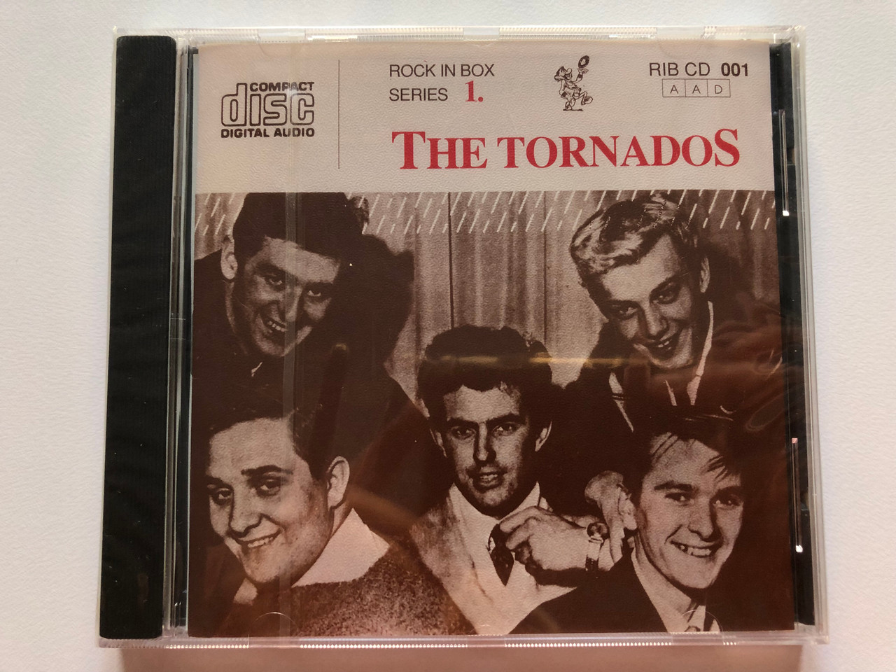 https://cdn10.bigcommerce.com/s-62bdpkt7pb/products/0/images/203253/The_Tornados_Rock_In_Box_Series_1._Rock_In_Box_Audio_CD_RIB_CD_001_1__19802.1640704448.1280.1280.JPG?c=2&_gl=1*13zsv9h*_ga*MjA2NTIxMjE2MC4xNTkwNTEyNTMy*_ga_WS2VZYPC6G*MTY0MDcwMjMxMS4yMzcuMS4xNjQwNzA0MzYwLjU4