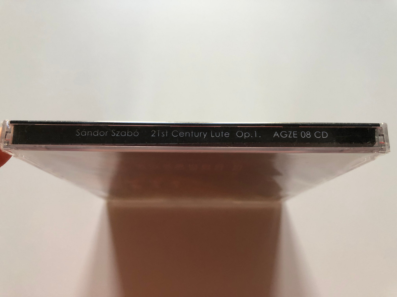 https://cdn10.bigcommerce.com/s-62bdpkt7pb/products/0/images/203288/Sandor_Szabo_-_21st_Century_Lute_Op._1_AGZE_Audio_CD_2017_AGZE_08_CD_3__18629.1640710334.1280.1280.JPG?c=2&_gl=1*1k71wmf*_ga*MjA2NTIxMjE2MC4xNTkwNTEyNTMy*_ga_WS2VZYPC6G*MTY0MDcwMjMxMS4yMzcuMS4xNjQwNzEwMjA0Ljk.
