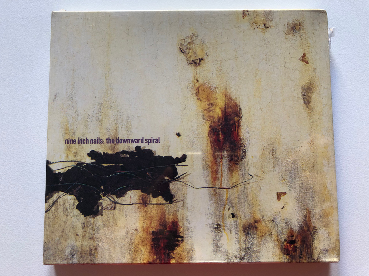 https://cdn10.bigcommerce.com/s-62bdpkt7pb/products/0/images/203317/Nine_Inch_Nails_The_Downward_Spiral_Island_Records_Audio_CD_1994_CID_8012522_126-2_1__39415.1640715735.1280.1280.JPG?c=2&_gl=1*123t46y*_ga*MjA2NTIxMjE2MC4xNTkwNTEyNTMy*_ga_WS2VZYPC6G*MTY0MDcwMjMxMS4yMzcuMS4xNjQwNzE1NTIxLjU5