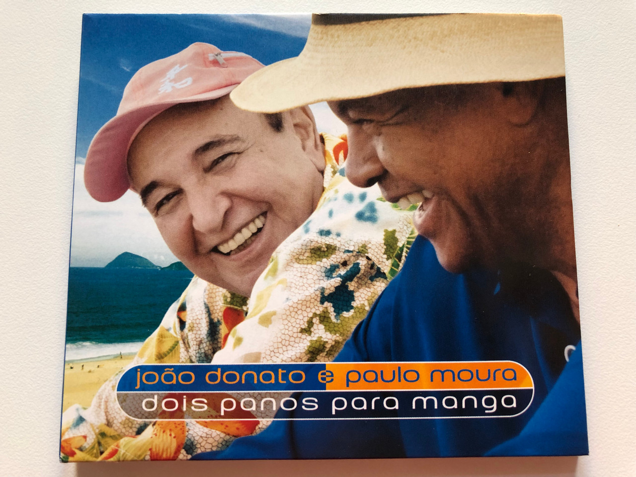 https://cdn10.bigcommerce.com/s-62bdpkt7pb/products/0/images/203357/Joo_Donato_E_Paulo_Moura_Dois_Panos_Para_Manga_Biscoito_Fino_Audio_CD_2006_BF-643_1__37339.1640784895.1280.1280.JPG?c=2&_gl=1*eg4sai*_ga*MjA2NTIxMjE2MC4xNTkwNTEyNTMy*_ga_WS2VZYPC6G*MTY0MDc4NDQ2Mi4yMzguMS4xNjQwNzg0OTM3LjYw