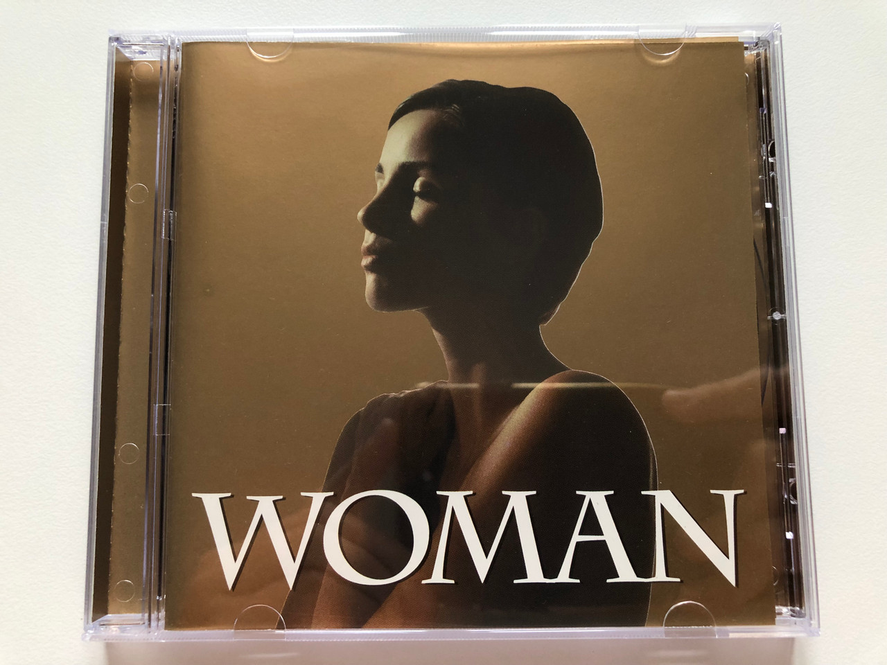 https://cdn10.bigcommerce.com/s-62bdpkt7pb/products/0/images/203623/Woman_Universal_Music_Audio_CD_2002_584_980-2_1__13883.1640870613.1280.1280.JPG?c=2&_gl=1*3d2vpe*_ga*MjA2NTIxMjE2MC4xNTkwNTEyNTMy*_ga_WS2VZYPC6G*MTY0MDg2NzM3NS4yMzkuMS4xNjQwODcwNTI5LjQy
