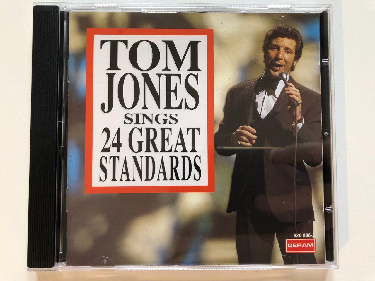 https://cdn10.bigcommerce.com/s-62bdpkt7pb/products/0/images/203709/Tom_Jones_Sings_24_Great_Standards_Deram_Audio_CD_1992_Stereo_820_886-2_1__60094.1640892484.1280.1280.JPG?c=2&_gl=1*1m8lqni*_ga*MjA2NTIxMjE2MC4xNTkwNTEyNTMy*_ga_WS2VZYPC6G*MTY0MDg5MjM0MC4yNDAuMC4xNjQwODkyMzQwLjYw
