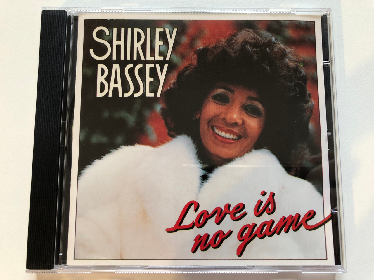https://cdn10.bigcommerce.com/s-62bdpkt7pb/products/0/images/203743/Shirley_Bassey_Love_Is_No_Game_Indisc_Audio_CD_1988_DICD_127891_1__88740.1640894709.1280.1280.JPG?c=2&_gl=1*147f5r1*_ga*MjA2NTIxMjE2MC4xNTkwNTEyNTMy*_ga_WS2VZYPC6G*MTY0MDg5MjM0MC4yNDAuMS4xNjQwODk0Mjg3LjU3