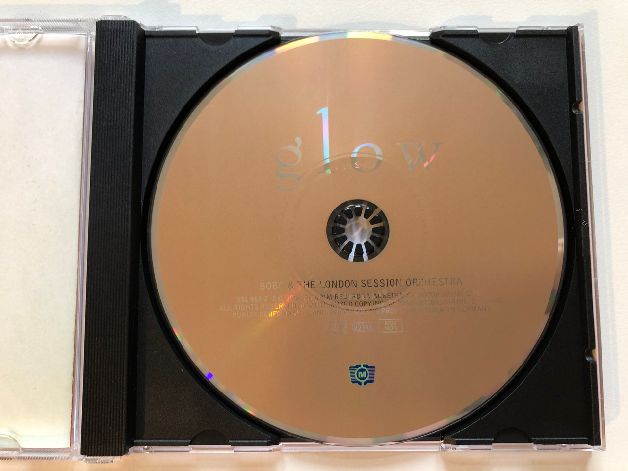 https://cdn10.bigcommerce.com/s-62bdpkt7pb/products/0/images/203778/Bobo_The_London_Session_Orchestra_-_Glow_-_Conducted_By_Wil_Malone_Motor_Music_Audio_CD_1996_531_963-2_3__45979.1640963342.1280.1280.JPG?c=2&_gl=1*bapirq*_ga*MjA2NTIxMjE2MC4xNTkwNTEyNTMy*_ga_WS2VZYPC6G*MTY0MDk2MTcwMy4yNDEuMS4xNjQwOTYzMzEyLjYw