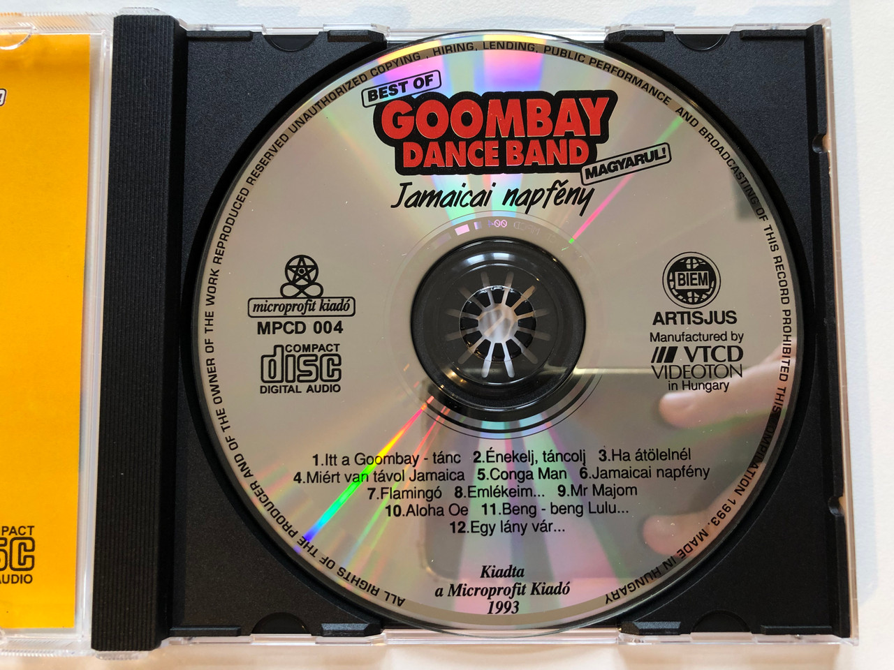 https://cdn10.bigcommerce.com/s-62bdpkt7pb/products/0/images/203827/Best_Of_Goombay_Dance_Band_Magyarul_-_Jamaicai_Napfny_Microprofit_Kiad_Audio_CD_1993_MPCD_004_3__00128.1640973458.1280.1280.JPG?c=2&_gl=1*u7ve5t*_ga*MjA2NTIxMjE2MC4xNTkwNTEyNTMy*_ga_WS2VZYPC6G*MTY0MDk3MDQ3NC4yNDMuMS4xNjQwOTczMjMzLjMz