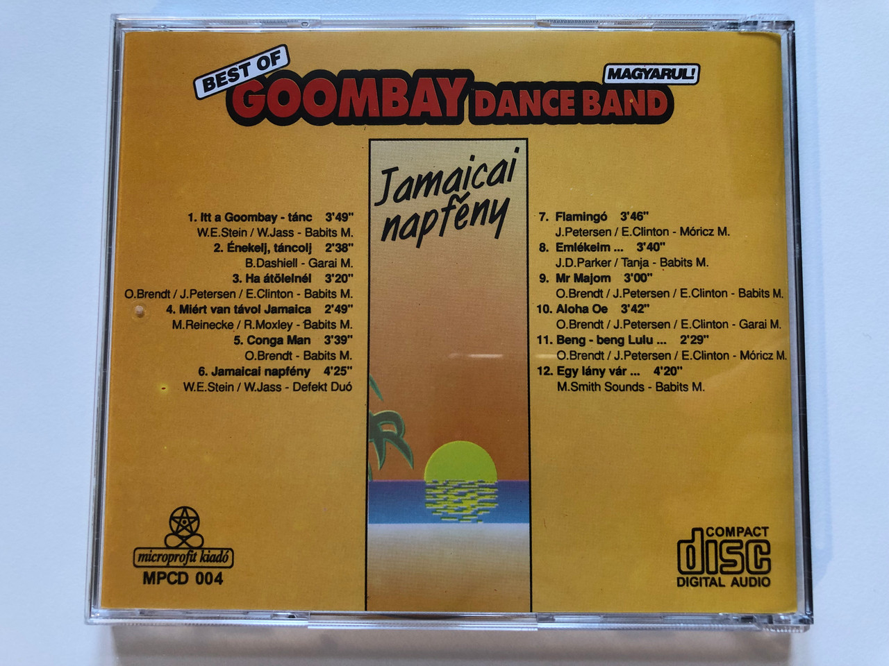 https://cdn10.bigcommerce.com/s-62bdpkt7pb/products/0/images/203829/Best_Of_Goombay_Dance_Band_Magyarul_-_Jamaicai_Napfny_Microprofit_Kiad_Audio_CD_1993_MPCD_004_4__16097.1640973458.1280.1280.JPG?c=2&_gl=1*u7ve5t*_ga*MjA2NTIxMjE2MC4xNTkwNTEyNTMy*_ga_WS2VZYPC6G*MTY0MDk3MDQ3NC4yNDMuMS4xNjQwOTczMjMzLjMz
