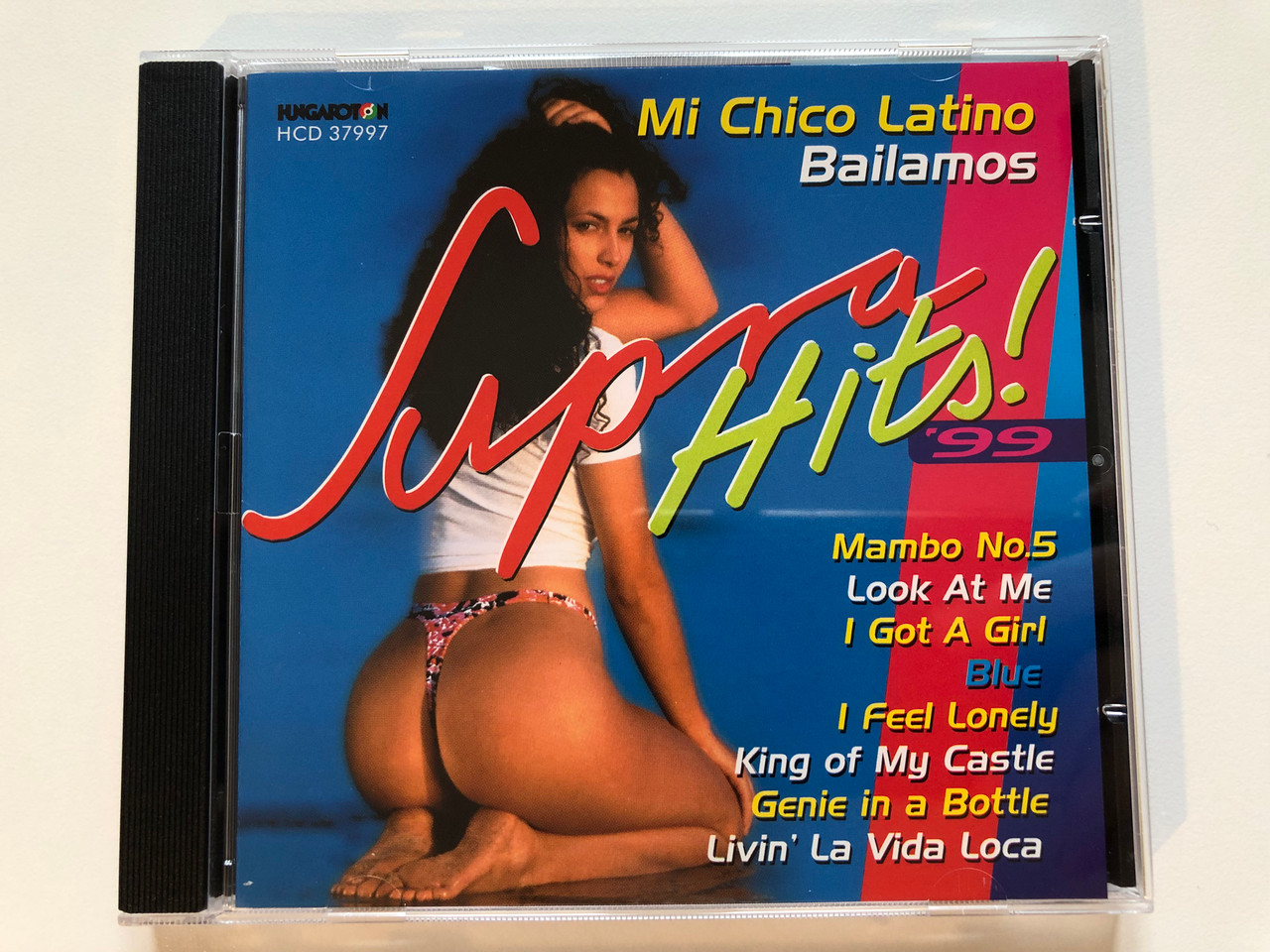 https://cdn10.bigcommerce.com/s-62bdpkt7pb/products/0/images/203834/Supra_Hits_99_Mi_Chico_Latino_Bailamos_Mambo_No._5_Look_At_Me_I_Got_A_Girl_Blue_I_Feel_Lonely_King_Of_My_Castle_Genie_In_A_Bottle_Livin_La_Vida_Loca_Hungaroton_Audio_CD_1999_HC_1__67613.1640973796.1280.1280.JPG?c=2&_gl=1*z2jtgo*_ga*MjA2NTIxMjE2MC4xNTkwNTEyNTMy*_ga_WS2VZYPC6G*MTY0MDk3MDQ3NC4yNDMuMS4xNjQwOTczNTYyLjIw