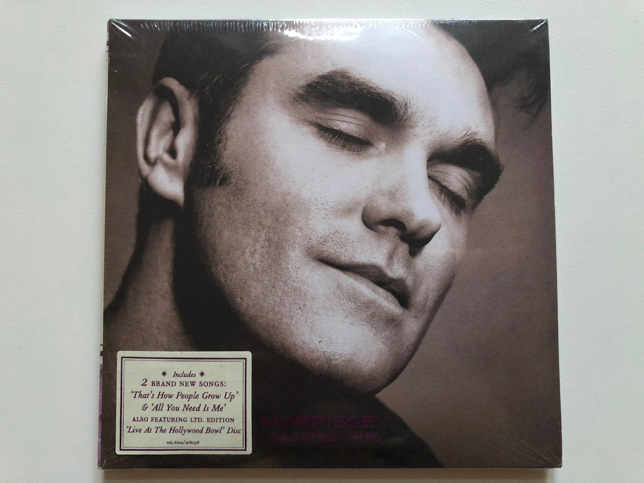 https://cdn10.bigcommerce.com/s-62bdpkt7pb/products/0/images/204515/Morrissey_Greatest_Hits_Includes_2_Brand_Songs_Thats_How_People_Grow_Up_All_You_Need_Is_Me_also_featuring_ltd._edition_Live_At_The_Hollywood_Bowl_Disc_Decca_2x_Audio_CD_SKL6004_1__49868.1641367198.1280.1280.JPG?c=2&_gl=1*ozf4kd*_ga*MjA2NTIxMjE2MC4xNTkwNTEyNTMy*_ga_WS2VZYPC6G*MTY0MTM1OTgzNy4yNDcuMS4xNjQxMzY3MDA0LjM5