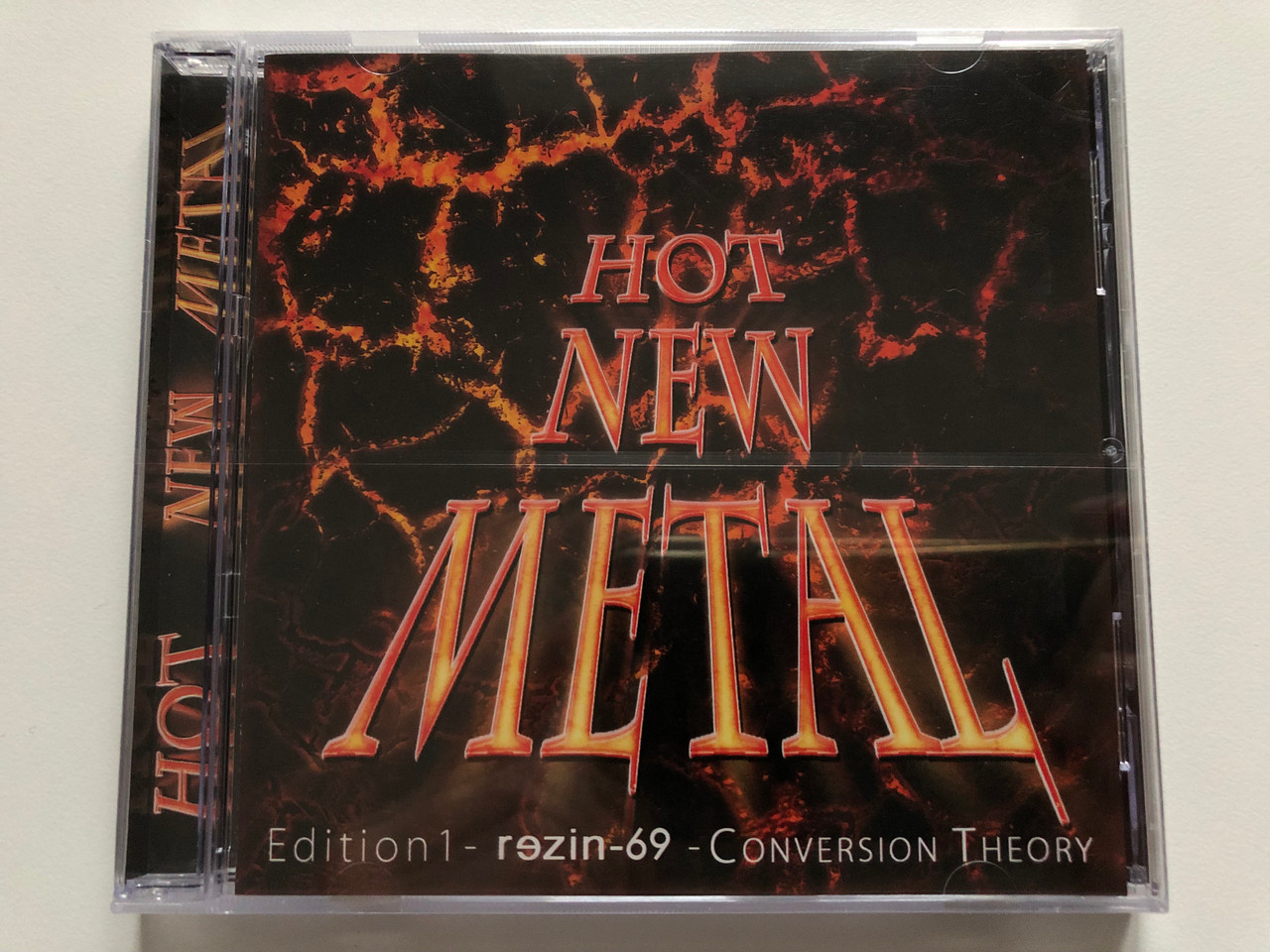 https://cdn10.bigcommerce.com/s-62bdpkt7pb/products/0/images/204938/Hot_New_Metal_-_Edition_1_-_rezin-69_-_Conversion_Theory_Cannon_Media_Audio_CD_CAN086_1__63168.1641540949.1280.1280.JPG?c=2&_gl=1*zk28kx*_ga*MjA2NTIxMjE2MC4xNTkwNTEyNTMy*_ga_WS2VZYPC6G*MTY0MTUzNDM0OS4yNTEuMS4xNjQxNTQwNzU0LjM5