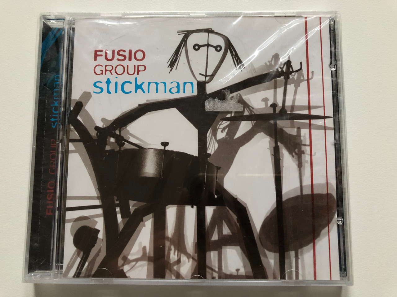 https://cdn10.bigcommerce.com/s-62bdpkt7pb/products/0/images/204941/Fusio_Group_Stickman_Tom-Tom_Records_Audio_CD_2007_TTCD_95_1__20241.1641541310.1280.1280.JPG?c=2&_gl=1*14rpub6*_ga*MjA2NTIxMjE2MC4xNTkwNTEyNTMy*_ga_WS2VZYPC6G*MTY0MTUzNDM0OS4yNTEuMS4xNjQxNTQxMjE1LjMy