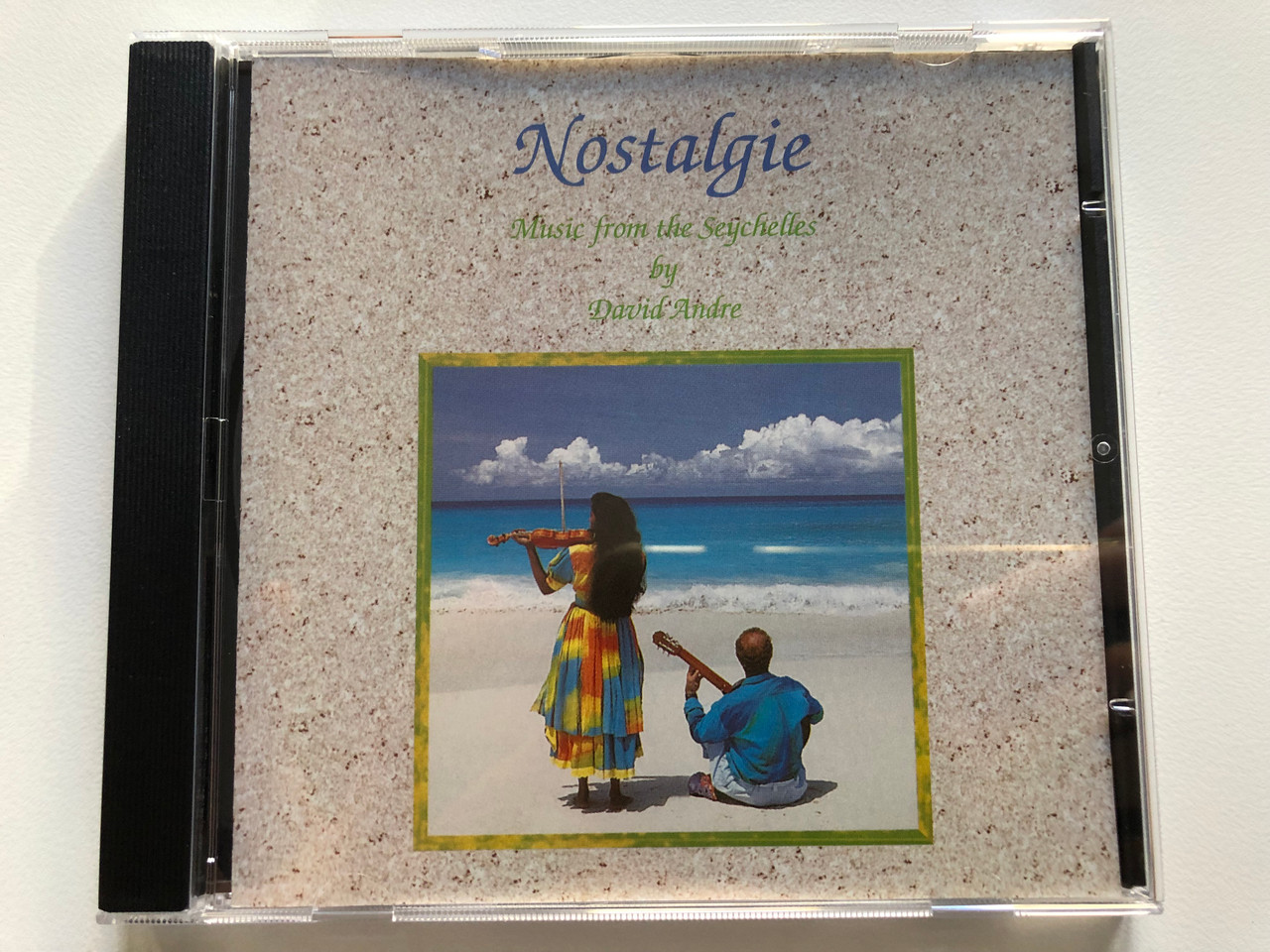 https://cdn10.bigcommerce.com/s-62bdpkt7pb/products/0/images/205747/Nostalgie_-_Music_from_the_Seychelles_by_David_Andre_Audio_CD_1994_DAP_01_1__35863.1641831604.1280.1280.JPG?c=2&_gl=1*xmn5i0*_ga*MjA2NTIxMjE2MC4xNTkwNTEyNTMy*_ga_WS2VZYPC6G*MTY0MTgyODg5Mi4yNTMuMS4xNjQxODMxNDMxLjUx