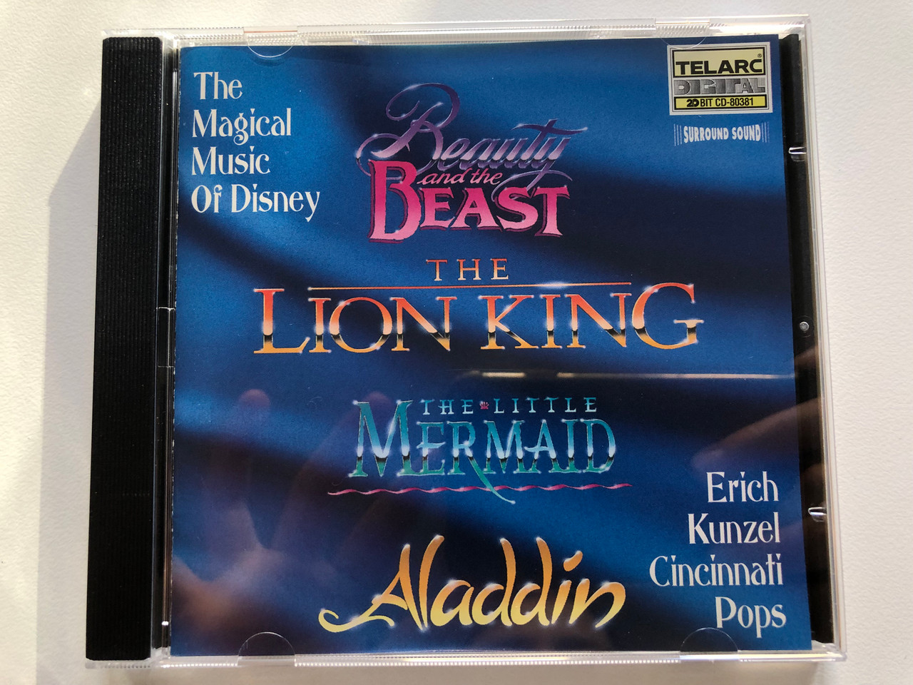 https://cdn10.bigcommerce.com/s-62bdpkt7pb/products/0/images/205760/The_Magical_Music_Of_Disney_Beauty_and_the_Beast_The_Lion_King_The_Little_Mermaid_Aladdin_Erich_Kunzel_Cincinnati_Pops_Telarc_Audio_CD_1995_CD-80381_1__38893.1641833855.1280.1280.JPG?c=2&_gl=1*2m7400*_ga*MjA2NTIxMjE2MC4xNTkwNTEyNTMy*_ga_WS2VZYPC6G*MTY0MTgyODg5Mi4yNTMuMS4xNjQxODMyODE3LjQ3