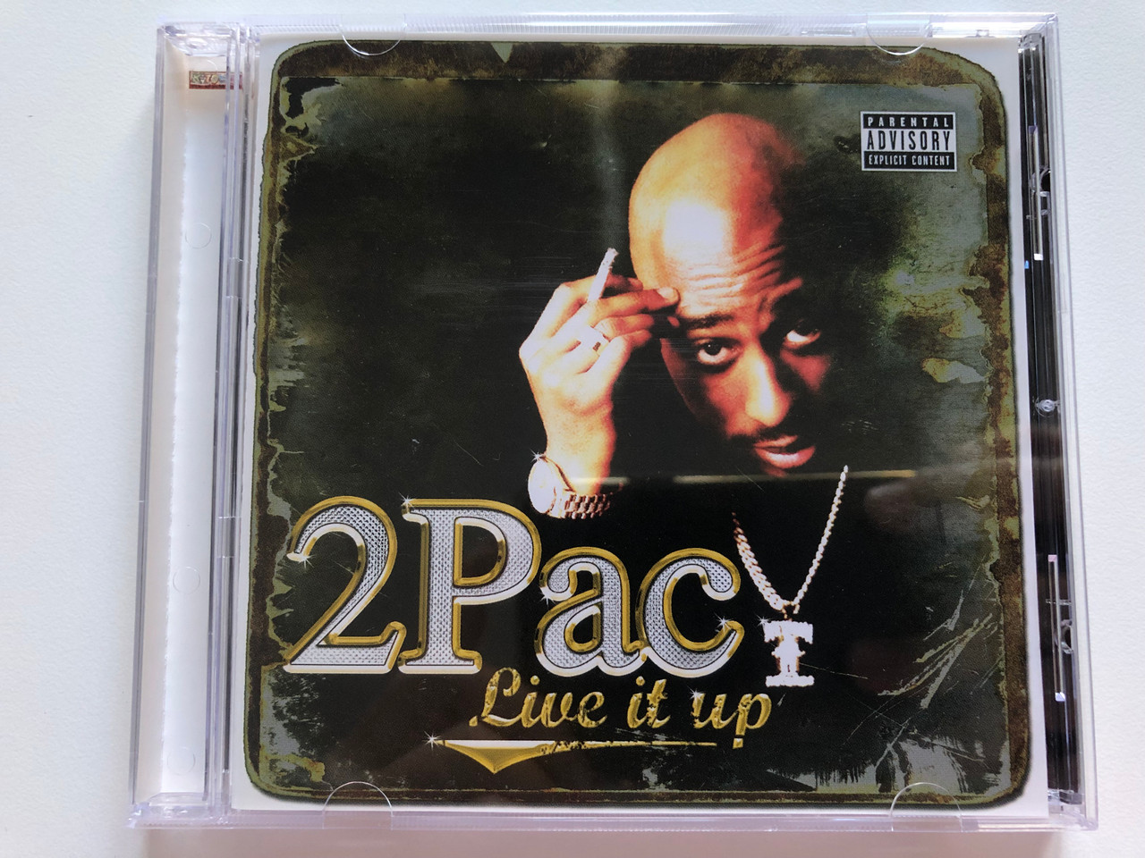 https://cdn10.bigcommerce.com/s-62bdpkt7pb/products/0/images/205866/2Pac_Live_It_Up_K-Town_Records_Audio_CD_2007_KTR_10078-2_1__37593.1641838841.1280.1280.JPG?c=2&_gl=1*marayg*_ga*MjA2NTIxMjE2MC4xNTkwNTEyNTMy*_ga_WS2VZYPC6G*MTY0MTgyODg5Mi4yNTMuMS4xNjQxODM4NjkwLjIw
