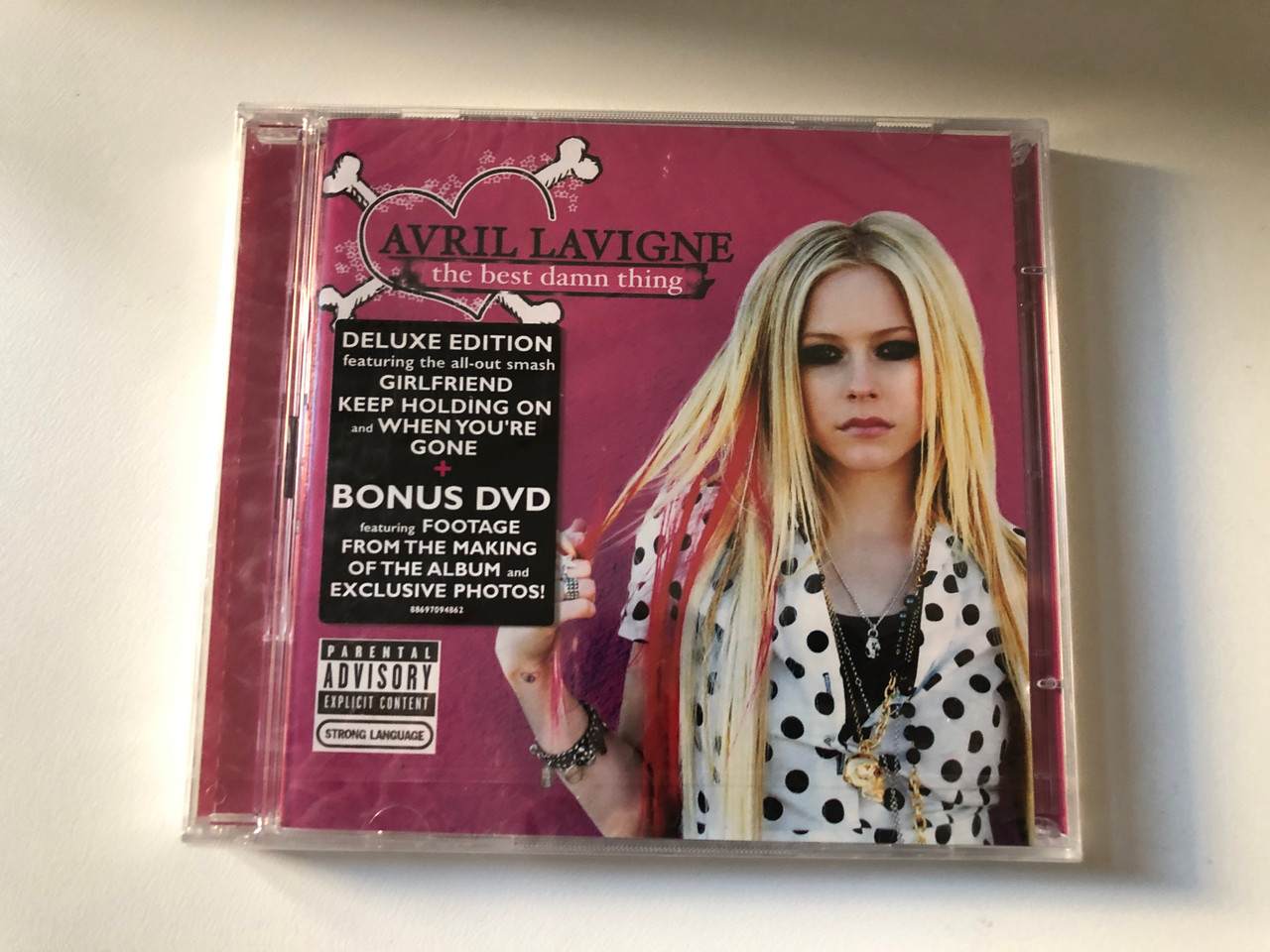 https://cdn10.bigcommerce.com/s-62bdpkt7pb/products/0/images/206351/Avril_Lavigne_The_Best_Damn_Thing_Deluxe_Edition._Featuring_the_all-out_smash_Girlfriend_Keep_Holding_On_and_When_Youre_Gone_Bonus_DVD_featuring_Footage_From_The_Making_Of_The_Al_1__05027.1641981174.1280.1280.JPG?c=2&_gl=1*18ycyi4*_ga*MjA2NTIxMjE2MC4xNTkwNTEyNTMy*_ga_WS2VZYPC6G*MTY0MTk4MDMxNy4yNTcuMS4xNjQxOTgwOTY3LjUy