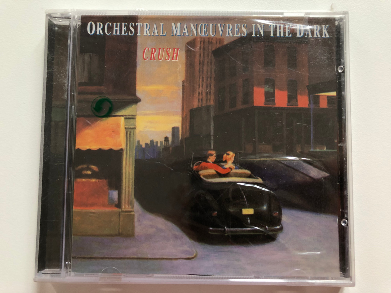 https://cdn10.bigcommerce.com/s-62bdpkt7pb/products/0/images/207650/Orchestral_Manuvres_In_The_Dark_Crush_Disky_Audio_CD_1996_VI_874762_1__12076.1642411158.1280.1280.JPG?c=2&_gl=1*1vbfivl*_ga*MjA2NTIxMjE2MC4xNTkwNTEyNTMy*_ga_WS2VZYPC6G*MTY0MjQwMzU5OS4yNjQuMS4xNjQyNDExMTA5LjYw