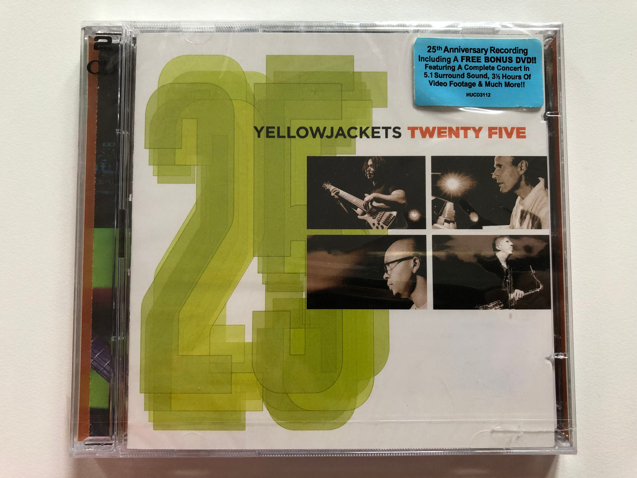 https://cdn10.bigcommerce.com/s-62bdpkt7pb/products/0/images/207709/Yellowjackets_Twenty_Five_25th_Anniversary_Recording_Including_A_Free_Bonus_DVD_Featuring_A_Complete_Concert_Heads_Up_International_Audio_CD_2006_HUCD_3112_1__23415.1642416123.1280.1280.JPG?c=2&_gl=1*uoyjds*_ga*MjA2NTIxMjE2MC4xNTkwNTEyNTMy*_ga_WS2VZYPC6G*MTY0MjQwMzU5OS4yNjQuMS4xNjQyNDE1ODk4LjI3