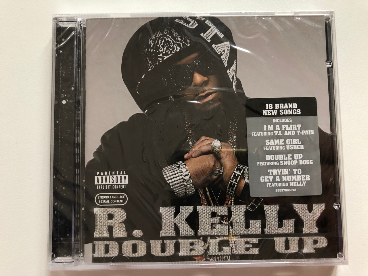 https://cdn10.bigcommerce.com/s-62bdpkt7pb/products/0/images/207820/R._Kelly_Double_Up_18_Brand_New_Songs_Includes_Im_A_Flirt_Featuring_T._I._and_T-Pain_Same_Girl_Featuring_Snoop_Dogg_Tryin_To_Get_A_Number_Featuring_Nelly_Jive_Audio_CD_2007_88_1__22206.1642493013.1280.1280.JPG?c=2&_gl=1*1cv4hcu*_ga*MjA2NTIxMjE2MC4xNTkwNTEyNTMy*_ga_WS2VZYPC6G*MTY0MjQ4NzMxNy4yNjUuMS4xNjQyNDkyODAzLjQ5