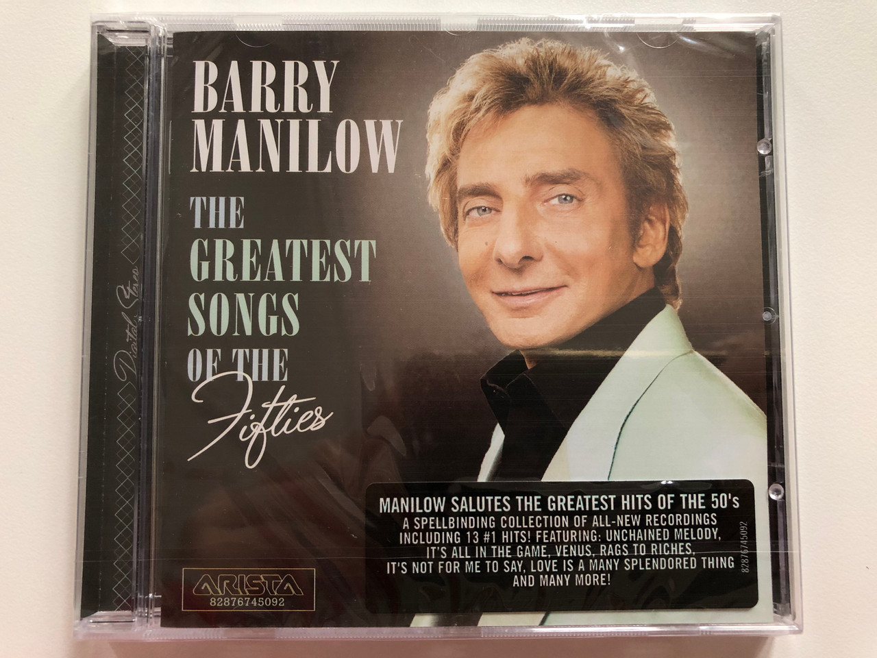 https://cdn10.bigcommerce.com/s-62bdpkt7pb/products/0/images/207835/Barry_Manilow_The_Greatest_Songs_Of_The_Fifties_Manilow_Salutes_The_Greatest_Hits_Of_The_50s._A_Spellbinding_Collection_Of_All-New_Recordings_Including_13_1_Hits_Featuring_Unchained_Me_1__83432.1642495954.1280.1280.JPG?c=2&_gl=1*1szxsgy*_ga*MjA2NTIxMjE2MC4xNTkwNTEyNTMy*_ga_WS2VZYPC6G*MTY0MjQ4NzMxNy4yNjUuMS4xNjQyNDk1NTQ1LjU5