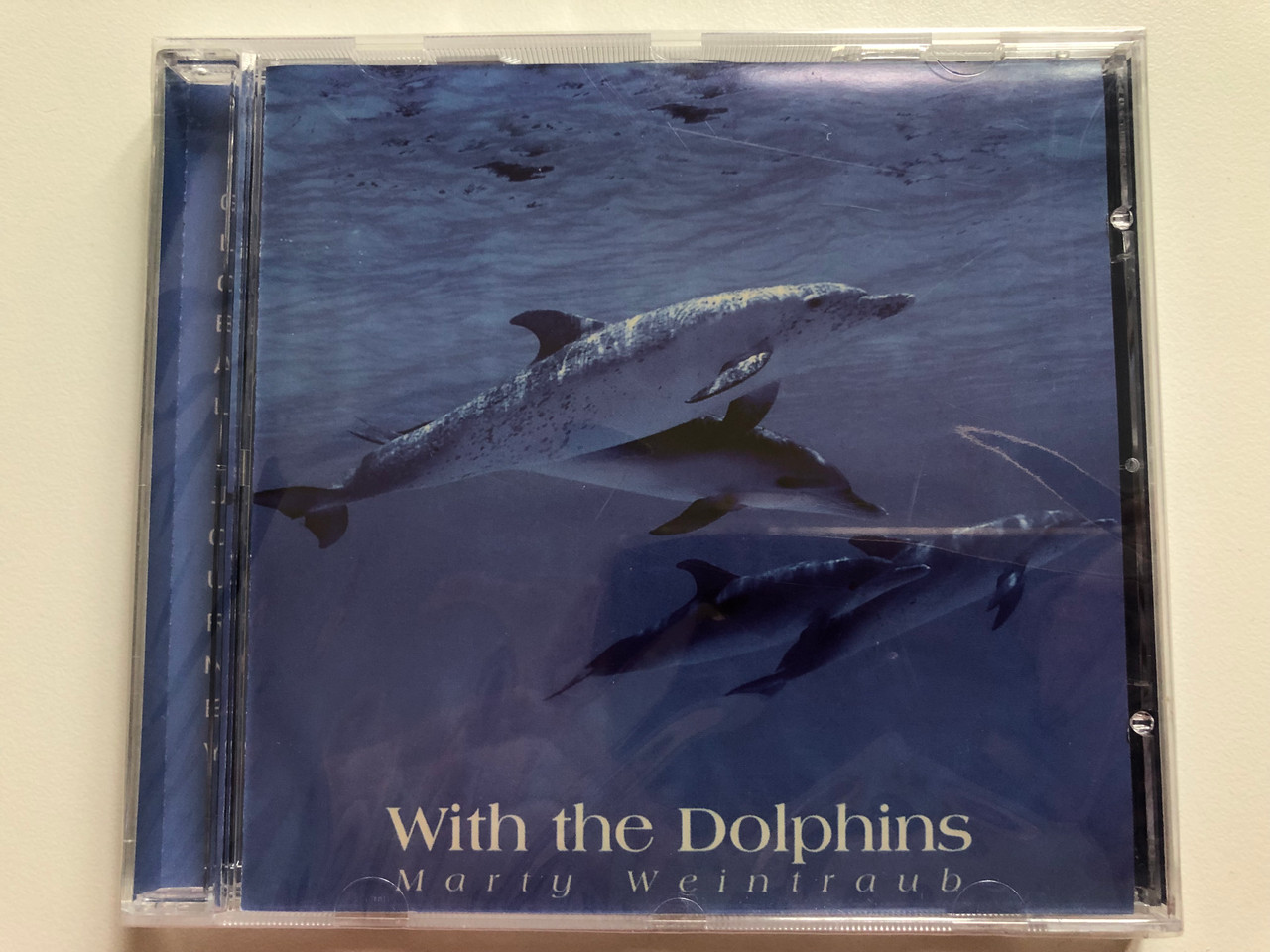 https://cdn10.bigcommerce.com/s-62bdpkt7pb/products/0/images/207868/Marty_Weintraub_With_The_Dolphins_Global_Journey_Audio_CD_1996_GJ3615_1__40881.1642501305.1280.1280.JPG?c=2&_gl=1*1vhxghl*_ga*MjA2NTIxMjE2MC4xNTkwNTEyNTMy*_ga_WS2VZYPC6G*MTY0MjQ4NzMxNy4yNjUuMS4xNjQyNTAxMTc2LjM2