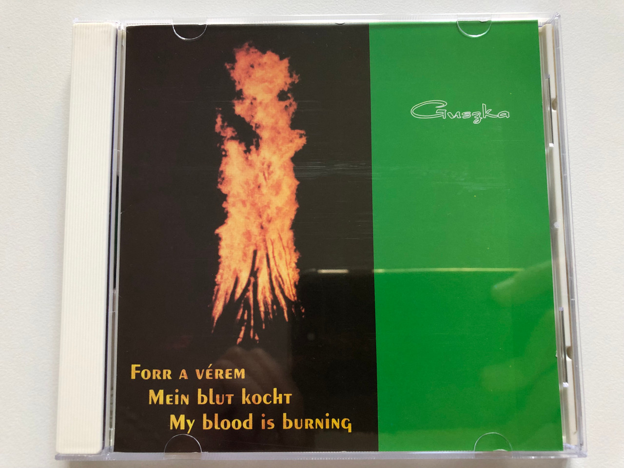 https://cdn10.bigcommerce.com/s-62bdpkt7pb/products/0/images/208130/Guszka_-_Forr_a_verem_Mein_blut_kocht_My_blood_is_burning_Audio_CD_0012_1__21262.1642661795.1280.1280.JPG?c=2&_gl=1*16b8xl8*_ga*MjA2NTIxMjE2MC4xNTkwNTEyNTMy*_ga_WS2VZYPC6G*MTY0MjY1NTc3MC4yNjcuMS4xNjQyNjYxNDg4LjM1