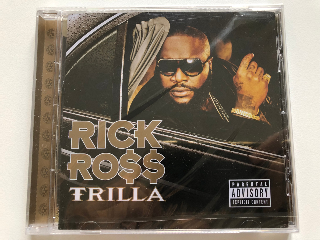https://cdn10.bigcommerce.com/s-62bdpkt7pb/products/0/images/208198/Rick_Ro_Trilla_Slip-N-Slide_Records_Audio_CD_2008_602517414266_1__59073.1642679760.1280.1280.JPG?c=2&_gl=1*16d7tsw*_ga*MjA2NTIxMjE2MC4xNTkwNTEyNTMy*_ga_WS2VZYPC6G*MTY0MjY3NjgyNy4yNjguMS4xNjQyNjc5NTQ3LjU3