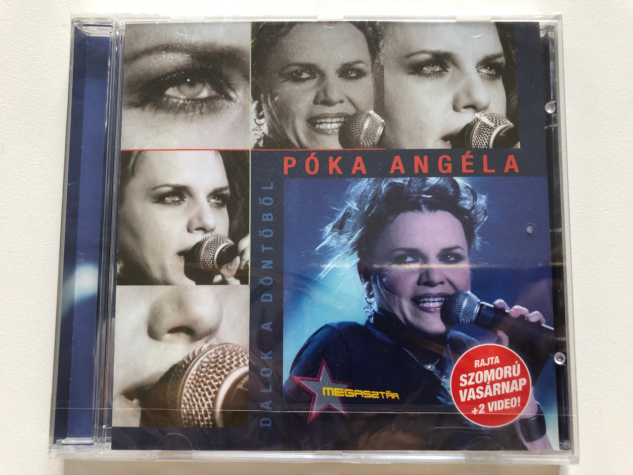 https://cdn10.bigcommerce.com/s-62bdpkt7pb/products/0/images/208253/Pka_Angla_Dalok_A_Dntbl_Rajta_Szomoru_Vasarnap_2_Video_Sony_BMG_Music_Entertainment_Audio_CD_2006_88697034082_1__24323.1642751503.1280.1280.JPG?c=2&_gl=1*11qifip*_ga*MjA2NTIxMjE2MC4xNTkwNTEyNTMy*_ga_WS2VZYPC6G*MTY0Mjc0ODQwMy4yNjkuMS4xNjQyNzUxNjc2LjYw