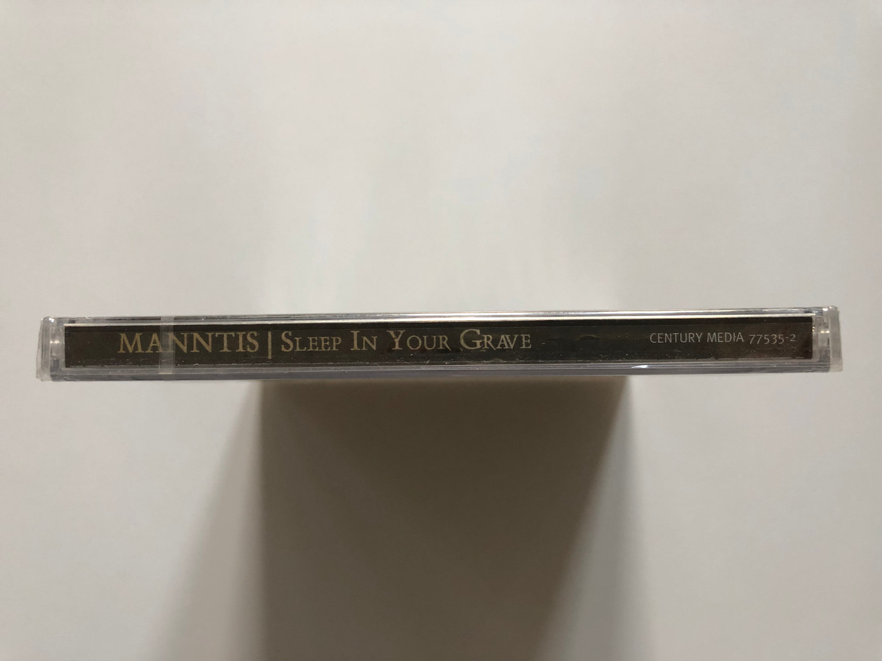 https://cdn10.bigcommerce.com/s-62bdpkt7pb/products/0/images/208270/Manntis_Sleep_In_Your_Grave_Century_Media_Audio_CD_2005_77535-2_3__01403.1642753774.1280.1280.JPG?c=2&_gl=1*cqebxf*_ga*MjA2NTIxMjE2MC4xNTkwNTEyNTMy*_ga_WS2VZYPC6G*MTY0Mjc0ODQwMy4yNjkuMS4xNjQyNzUzNTMyLjUz