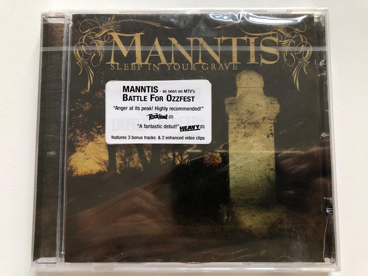 https://cdn10.bigcommerce.com/s-62bdpkt7pb/products/0/images/208272/Manntis_Sleep_In_Your_Grave_Century_Media_Audio_CD_2005_77535-2_1__58374.1642753781.1280.1280.JPG?c=2&_gl=1*cqebxf*_ga*MjA2NTIxMjE2MC4xNTkwNTEyNTMy*_ga_WS2VZYPC6G*MTY0Mjc0ODQwMy4yNjkuMS4xNjQyNzUzNTMyLjUz