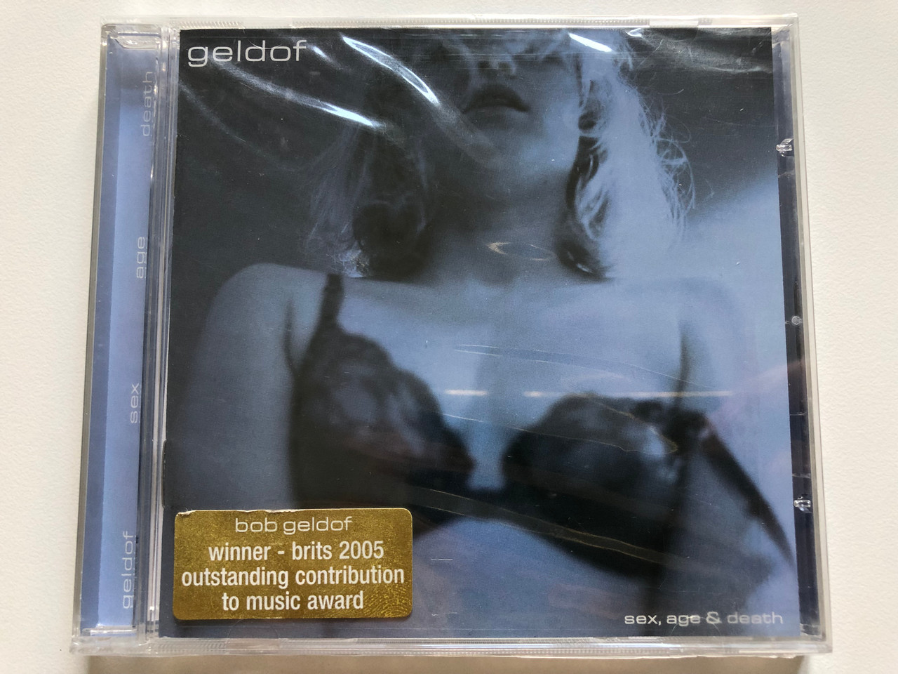 https://cdn10.bigcommerce.com/s-62bdpkt7pb/products/0/images/208293/Geldof_Sex_Age_Death_Winner_-_brits_2005_outstanding_contribution_to_music_award_Eagle_Records_Audio_CD_2001_EAGCD187_1__94972.1642761769.1280.1280.JPG?c=2&_gl=1*1qxoz9n*_ga*MjA2NTIxMjE2MC4xNTkwNTEyNTMy*_ga_WS2VZYPC6G*MTY0Mjc1OTk0My4yNzAuMS4xNjQyNzYxNjA2LjI1