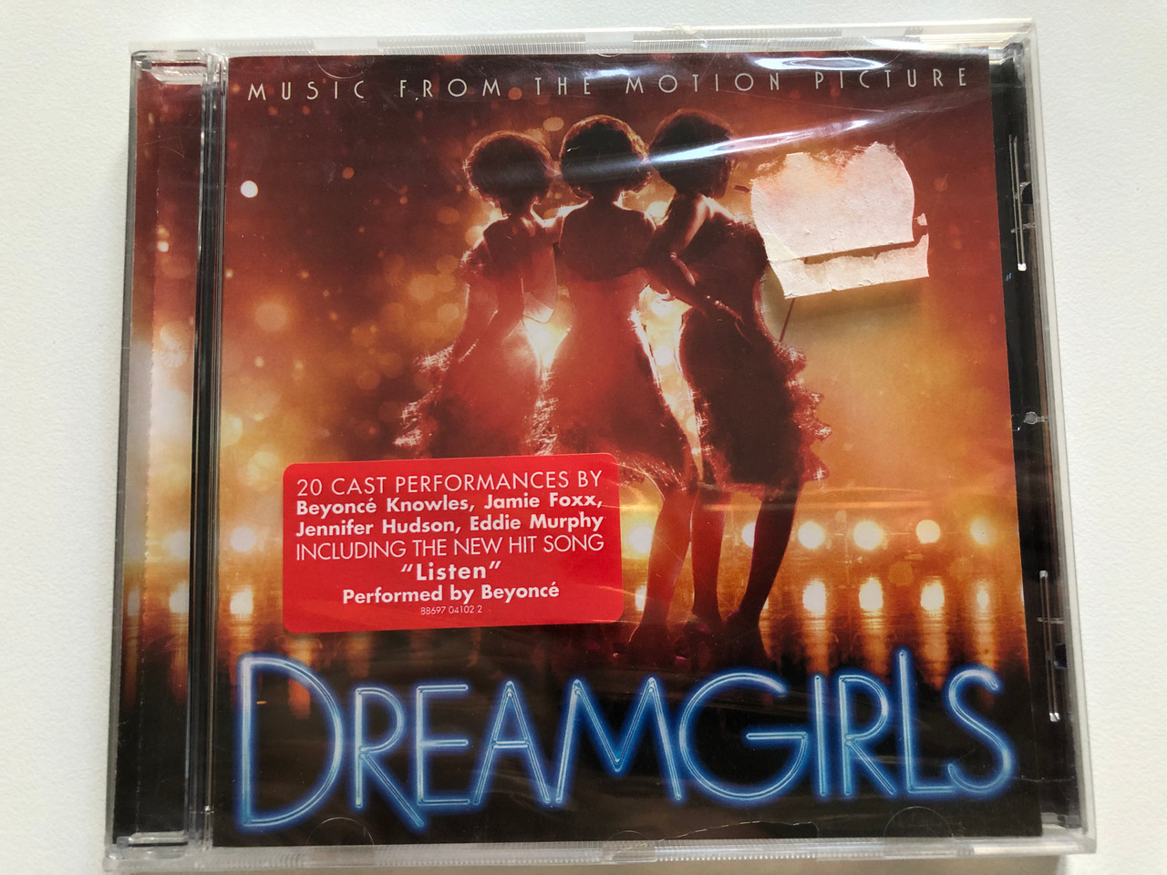 https://cdn10.bigcommerce.com/s-62bdpkt7pb/products/0/images/208315/Music_From_The_Motion_Picture_-_Dreamgirls_20_Cast_Performances_By_Beyonce_Knowles_Jamie_Foxx_Jennifer_Hudson_Eddie_Murphy_Including_The_New_Hit_Song_Listen_Performed_by_Beyonce_Mu_1__10554.1642764015.1280.1280.JPG?c=2&_gl=1*br4inb*_ga*MjA2NTIxMjE2MC4xNTkwNTEyNTMy*_ga_WS2VZYPC6G*MTY0Mjc1OTk0My4yNzAuMS4xNjQyNzYzODE0LjYw
