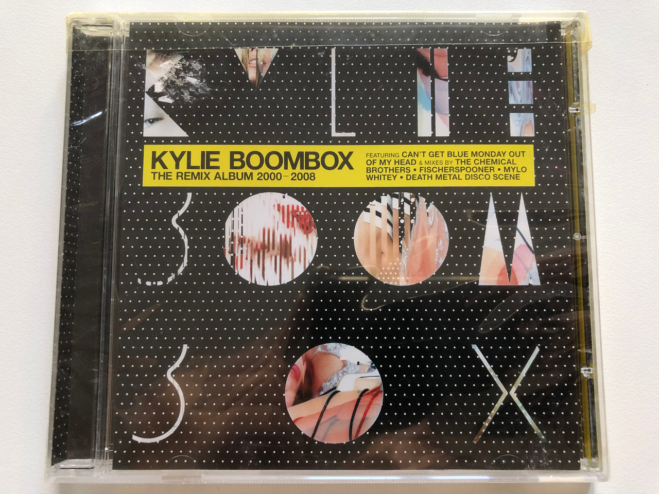 https://cdn10.bigcommerce.com/s-62bdpkt7pb/products/0/images/208318/Kylie_Boombox_The_Remix_Album_2000-2008_Featuring_Cant_Get_Blue_Monday_Out_Of_My_Head_Mixes_By_The_Chemical_Brothers_Fischerspooner_Mylo_Whitey_Death_Metal_Disco_Scene_Parlophone_Au_1__26091.1642764518.1280.1280.JPG?c=2&_gl=1*g3nrzs*_ga*MjA2NTIxMjE2MC4xNTkwNTEyNTMy*_ga_WS2VZYPC6G*MTY0Mjc1OTk0My4yNzAuMS4xNjQyNzY0NDg0LjYw