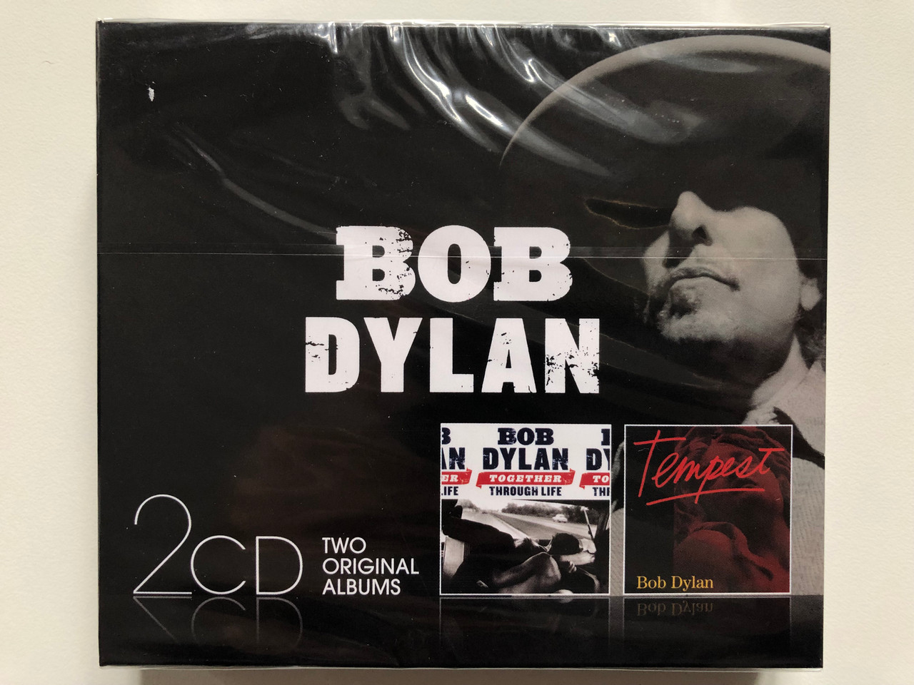 https://cdn10.bigcommerce.com/s-62bdpkt7pb/products/0/images/208599/Bob_Dylan_Together_Through_Life_Tempest_Sony_Music_2x_Audio_CD_2014_88843092182_1__42691.1643040211.1280.1280.JPG?c=2&_gl=1*dn6wgn*_ga*MjA2NTIxMjE2MC4xNTkwNTEyNTMy*_ga_WS2VZYPC6G*MTY0MzAzMjA3MC4yNzEuMS4xNjQzMDQwMDY2LjI2