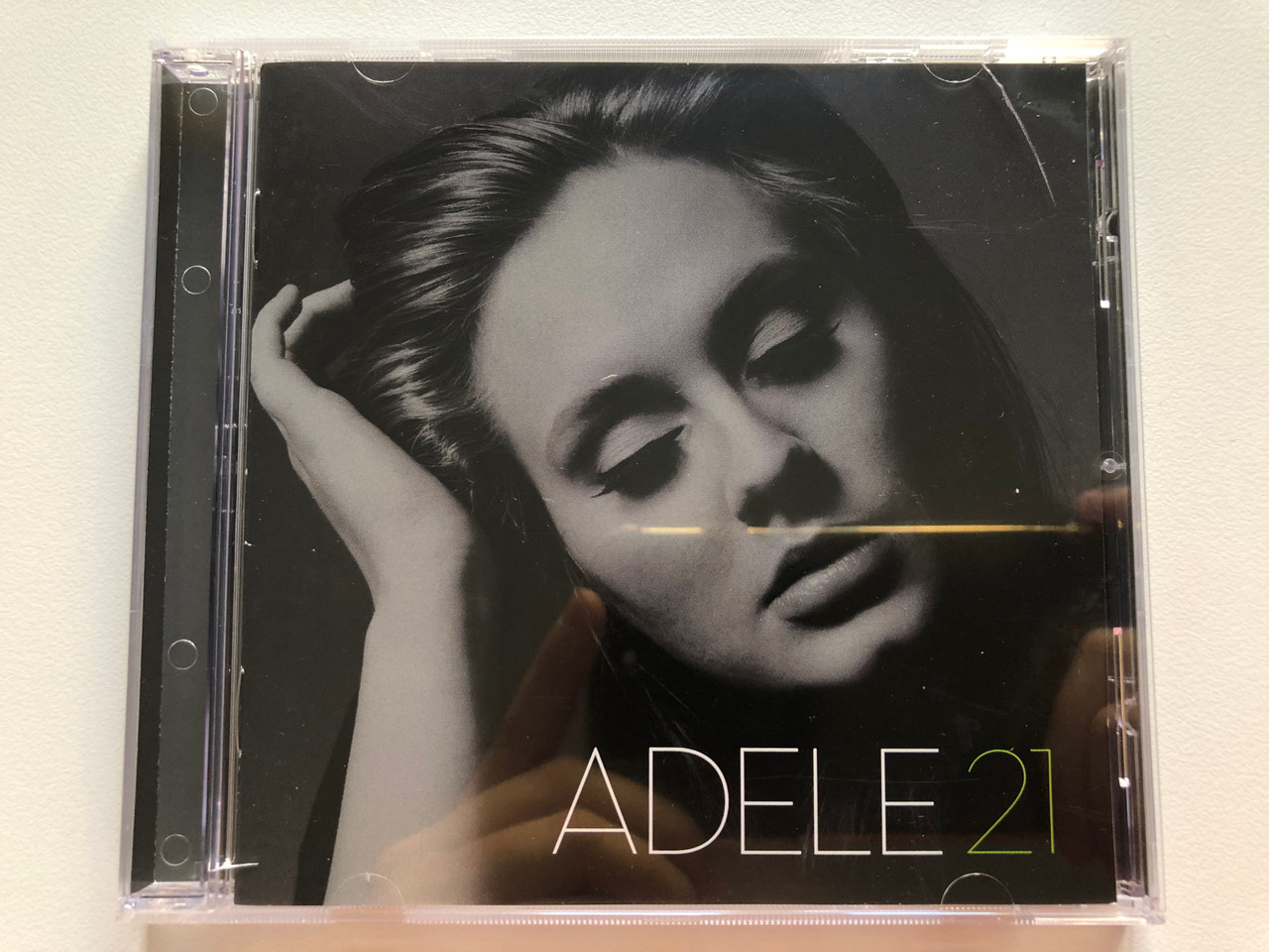 https://cdn10.bigcommerce.com/s-62bdpkt7pb/products/0/images/208907/Adele_21_XL_Recordings_Audio_CD_2011_XLCD_520E_1__29624.1643127283.1280.1280.JPG?c=2&_gl=1*2bcfws*_ga*MjA2NTIxMjE2MC4xNTkwNTEyNTMy*_ga_WS2VZYPC6G*MTY0MzEyNTY1Mi4yNzIuMS4xNjQzMTI3MTY1LjQ3