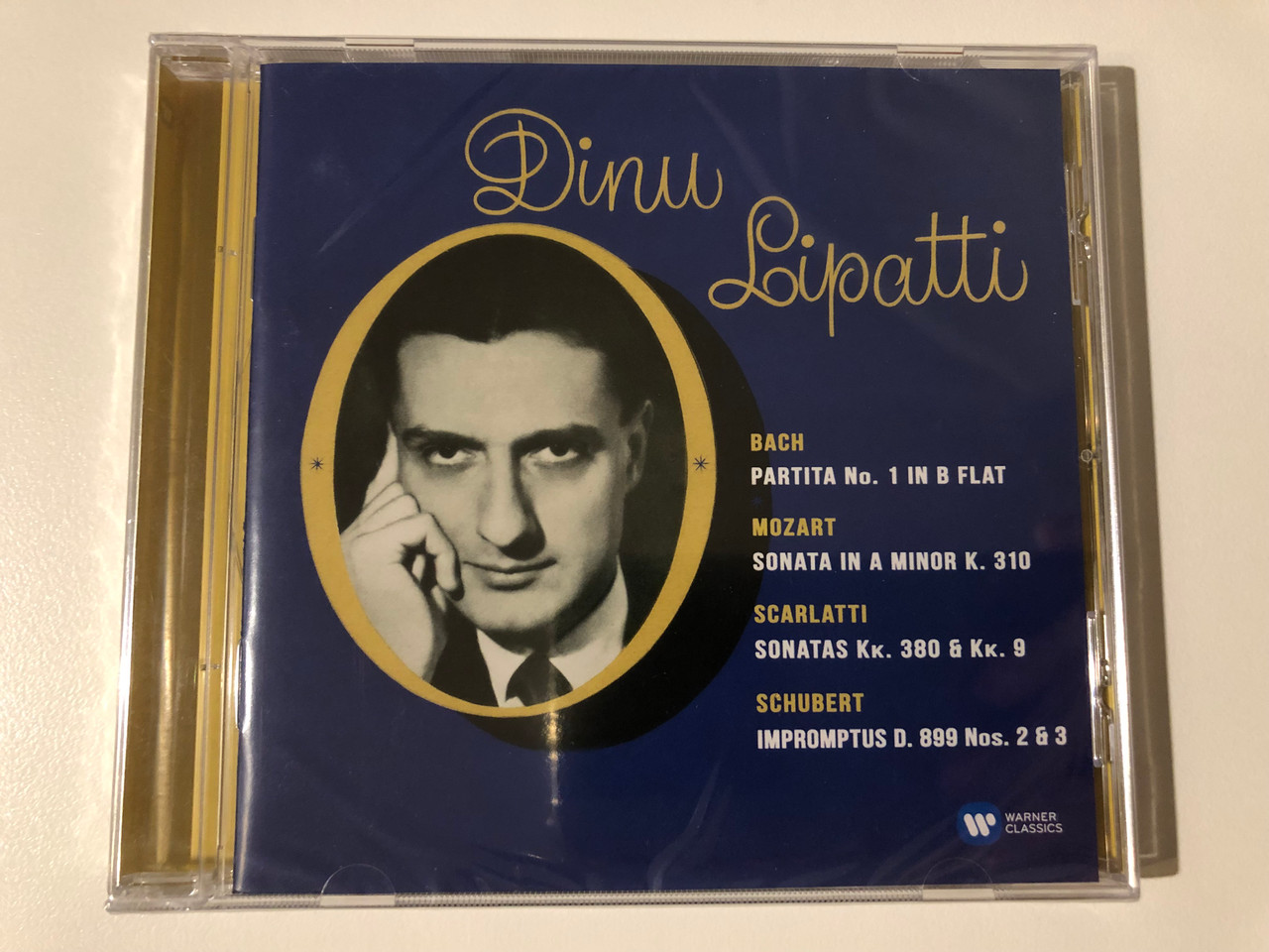 https://cdn10.bigcommerce.com/s-62bdpkt7pb/products/0/images/209031/Dinu_Lipatti_Bach_Partita_No.1_in_B_flat_Mozart_Sonata_In_A_Minor_K._310_Scarlatti_Sonatas_Kk._380_Kk._9_Schubert_Impromptus_D._899_Nos._2_3_EMI_Classics_Audio_CD_2015_Stereo_07243_1__83534.1643136208.1280.1280.JPG?c=2&_gl=1*w45451*_ga*MjA2NTIxMjE2MC4xNTkwNTEyNTMy*_ga_WS2VZYPC6G*MTY0MzEyNTY1Mi4yNzIuMS4xNjQzMTM1OTM0LjM5