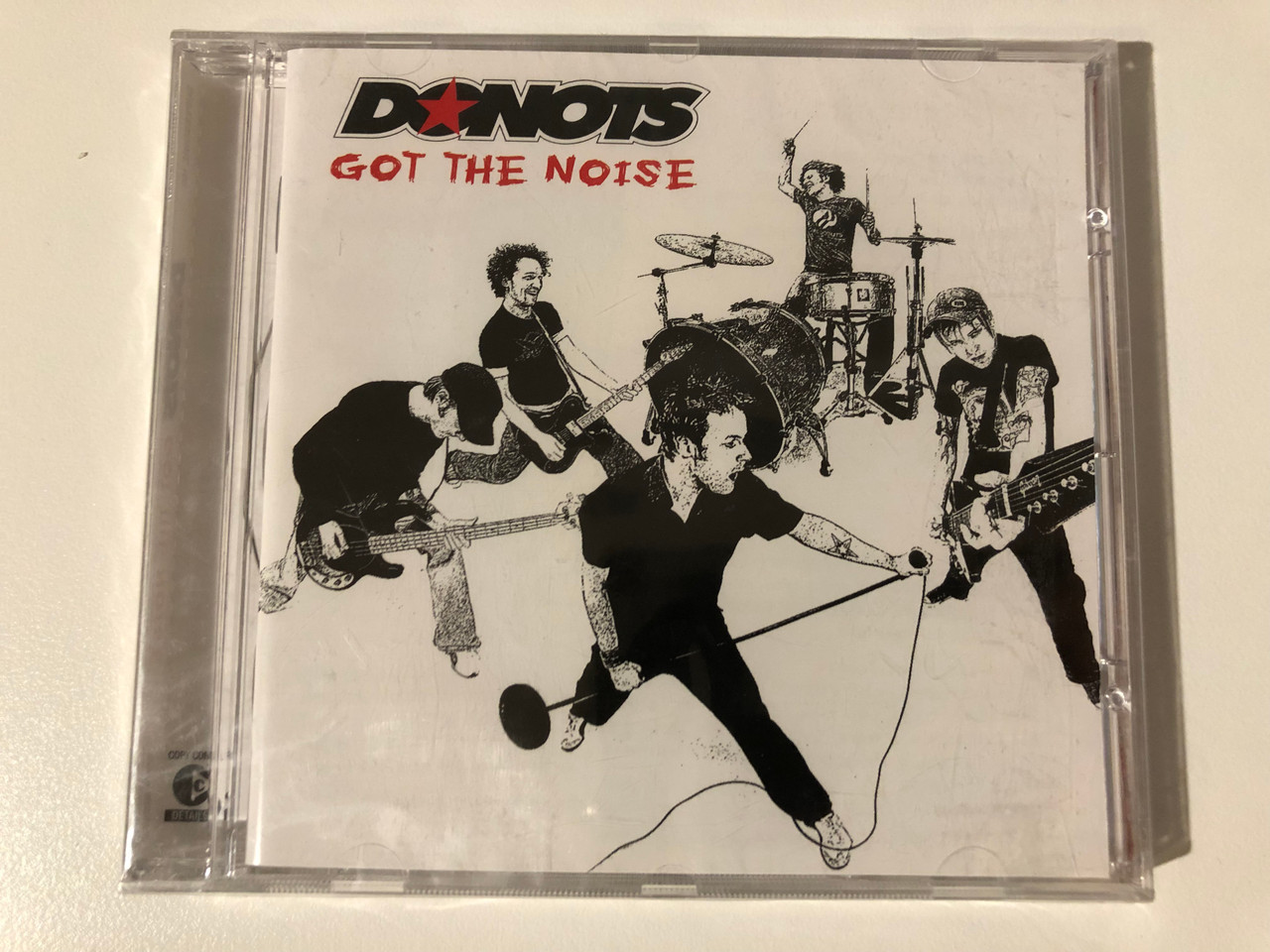 https://cdn10.bigcommerce.com/s-62bdpkt7pb/products/0/images/209210/Donots_Got_The_Noise_Supersonic_Records_Audio_CD_2004_Supersonic_160_1__65167.1643214679.1280.1280.JPG?c=2&_gl=1*1b55i6a*_ga*MjA2NTIxMjE2MC4xNTkwNTEyNTMy*_ga_WS2VZYPC6G*MTY0MzIwOTQ0MC4yNzMuMS4xNjQzMjE0NTY2LjI3