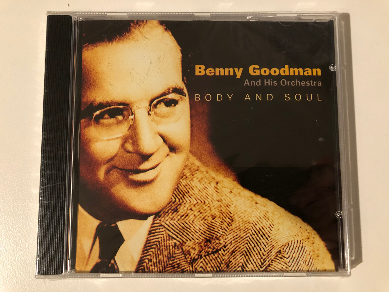 https://cdn10.bigcommerce.com/s-62bdpkt7pb/products/0/images/209222/Benny_Goodman_and_His_Orchestra_Body_And_Soul_Weton-Wesgram_Audio_CD_2005_LATA116_1__36615.1643216737.1280.1280.JPG?c=2&_gl=1*1udylee*_ga*MjA2NTIxMjE2MC4xNTkwNTEyNTMy*_ga_WS2VZYPC6G*MTY0MzIwOTQ0MC4yNzMuMS4xNjQzMjE2NjE5LjQ0