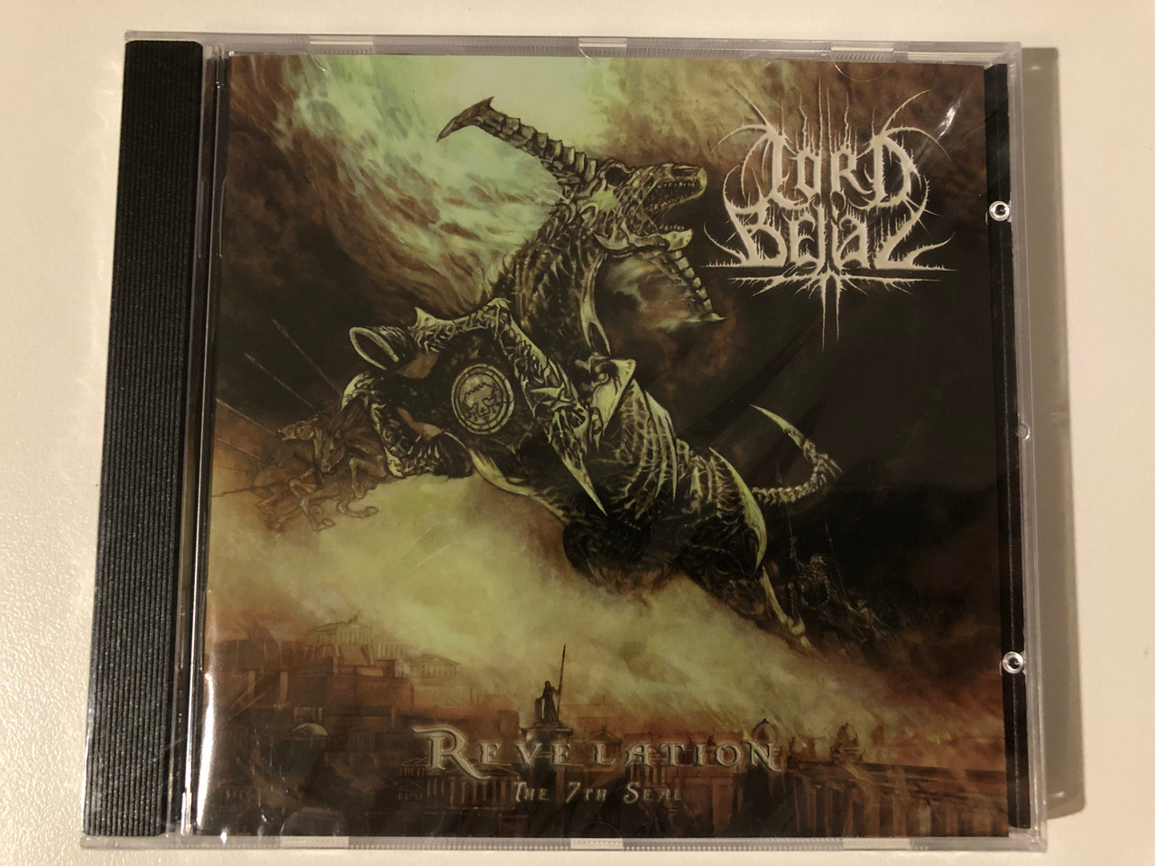 https://cdn10.bigcommerce.com/s-62bdpkt7pb/products/0/images/209285/Lord_Belial_Revelation_The_7th_Seal_Regain_Records_Audio_CD_RR114_1__30370.1643220878.1280.1280.JPG?c=2&_gl=1*bdawte*_ga*MjA2NTIxMjE2MC4xNTkwNTEyNTMy*_ga_WS2VZYPC6G*MTY0MzIwOTQ0MC4yNzMuMS4xNjQzMjIwNzE1LjMz