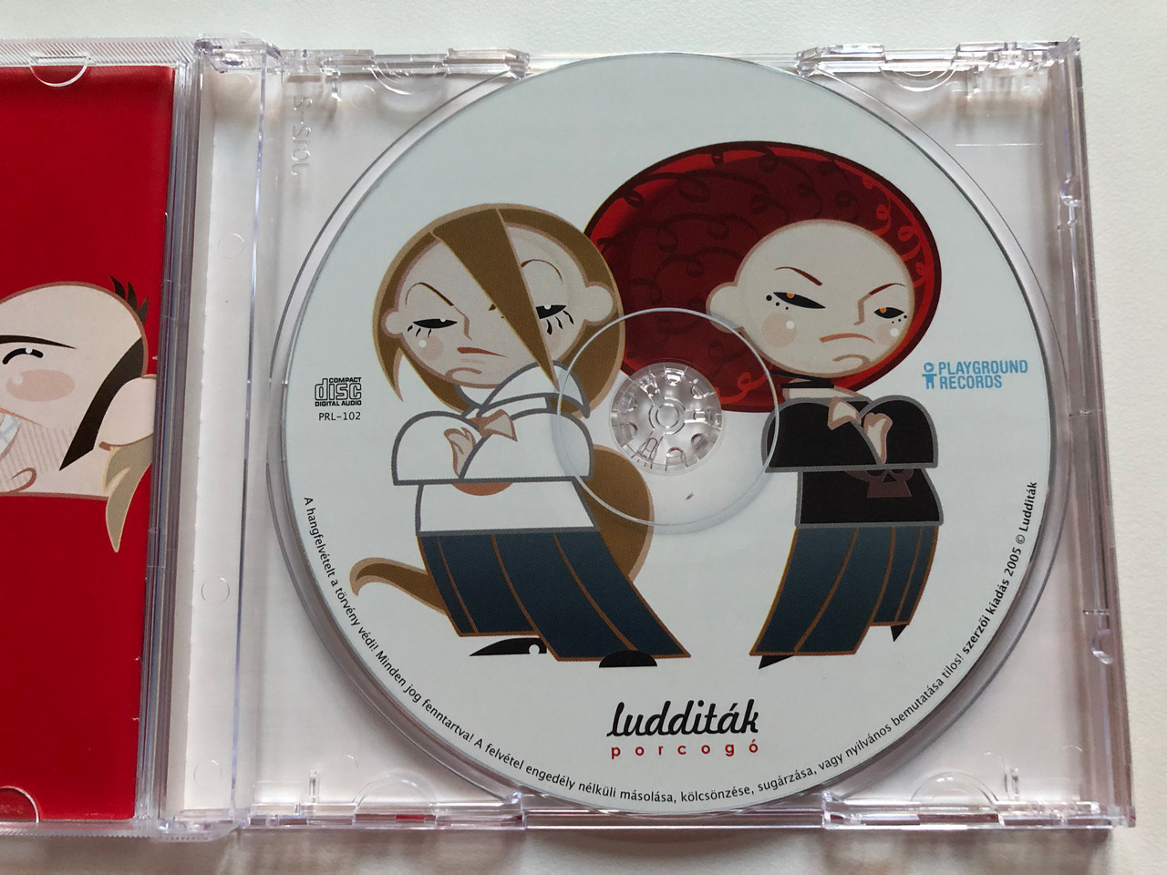 https://cdn10.bigcommerce.com/s-62bdpkt7pb/products/0/images/209959/Ludditk_Porcog_Playground_Records_Audio_CD_2005_PRL-102_3__84899.1643387432.1280.1280.JPG?c=2&_gl=1*tytgwm*_ga*MjA2NTIxMjE2MC4xNTkwNTEyNTMy*_ga_WS2VZYPC6G*MTY0MzM4MjMyNi4yNzkuMS4xNjQzMzg3NDA5LjYw