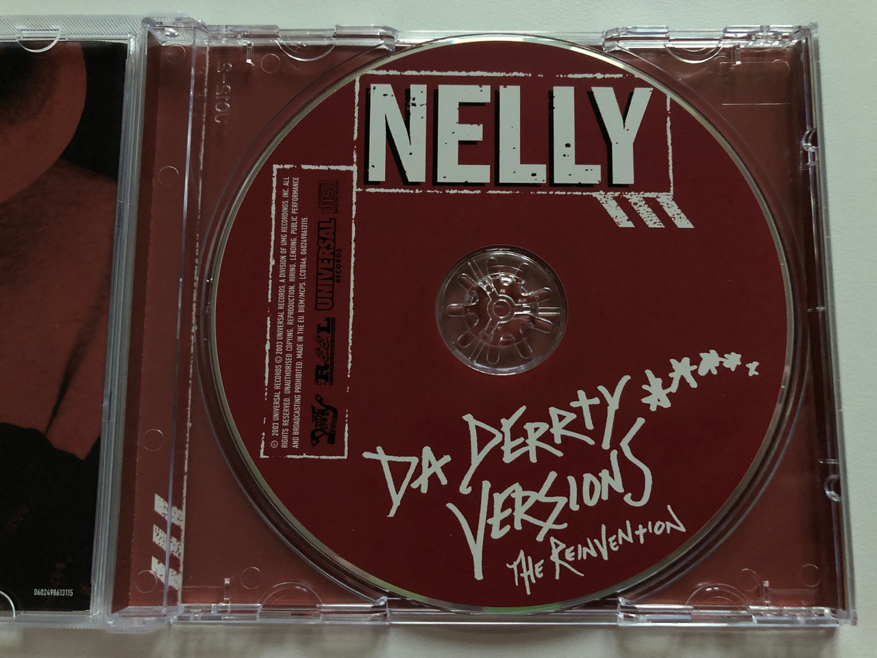 https://cdn10.bigcommerce.com/s-62bdpkt7pb/products/0/images/210056/Nelly_Da_Derrty_Versions_The_Reinvention_Universal_Records_Audio_CD_2003_0602498613115_3__48255.1643394030.1280.1280.JPG?c=2&_gl=1*1do03kt*_ga*MjA2NTIxMjE2MC4xNTkwNTEyNTMy*_ga_WS2VZYPC6G*MTY0MzM4MjMyNi4yNzkuMS4xNjQzMzkzMzM1LjE0