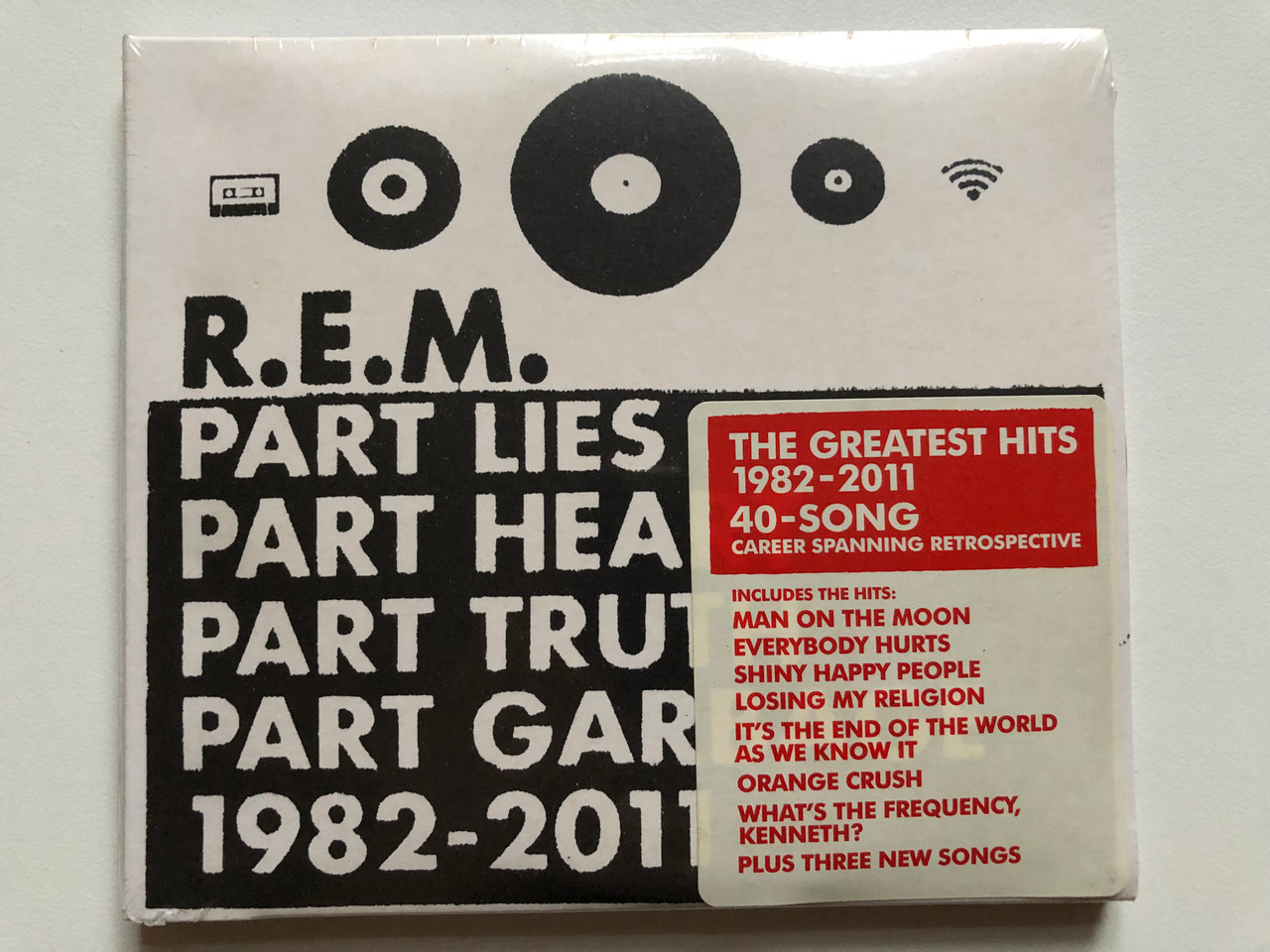https://cdn10.bigcommerce.com/s-62bdpkt7pb/products/0/images/210505/R.E.M._Part_Lies_Part_Heart_Part_Truth_Part_Garbage_1982_-_2011_The_Greatest_Hits_1982-2011_40-Song_Career_Spanning_Retrospective_Includes_The_Hits_Man_On_The_Moon_Everybody_Hurts_Warn_1__73251.1643621757.1280.1280.JPG?c=2&_gl=1*lnf1lh*_ga*MjA2NTIxMjE2MC4xNTkwNTEyNTMy*_ga_WS2VZYPC6G*MTY0MzYxMzI3MC4yODAuMS4xNjQzNjIxNjEzLjQ4