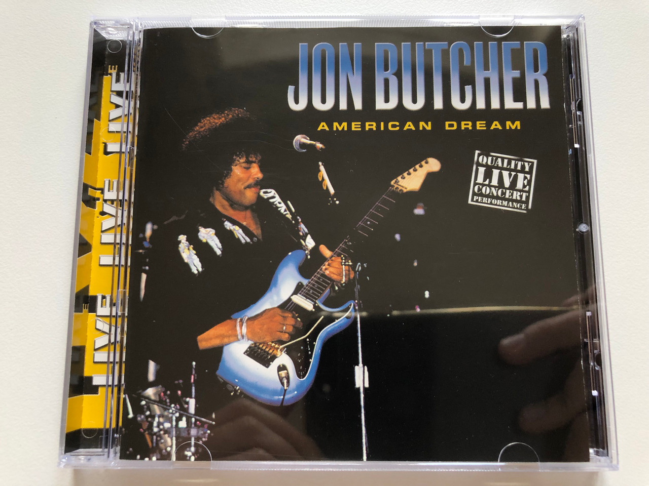 https://cdn10.bigcommerce.com/s-62bdpkt7pb/products/0/images/210866/Jon_Butcher_American_Dream_Quality_Live_Concert_Performance_Disky_Audio_CD_2001_SI_640362_1__43143.1643706671.1280.1280.JPG?c=2&_gl=1*mhhnst*_ga*MjA2NTIxMjE2MC4xNTkwNTEyNTMy*_ga_WS2VZYPC6G*MTY0MzY5MjIzNi4yODEuMS4xNjQzNzA2NTM3LjQz